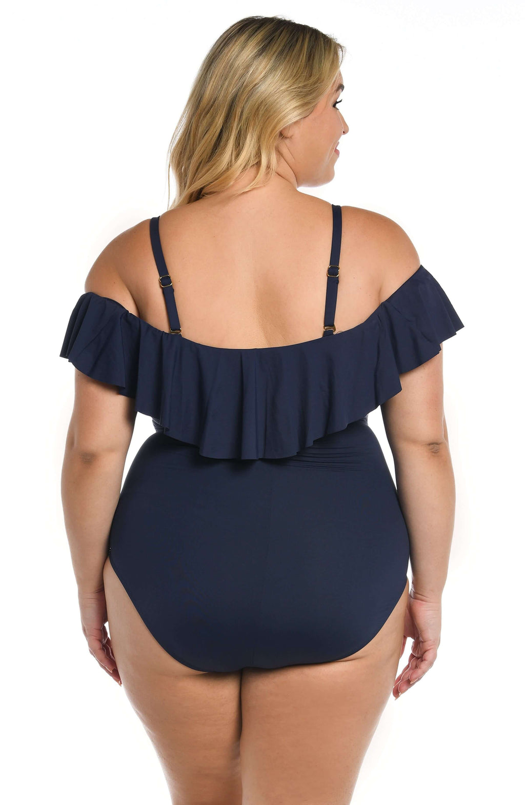 Woman wearing an indigo colored off-shoulder one piece swimsuit on a white background