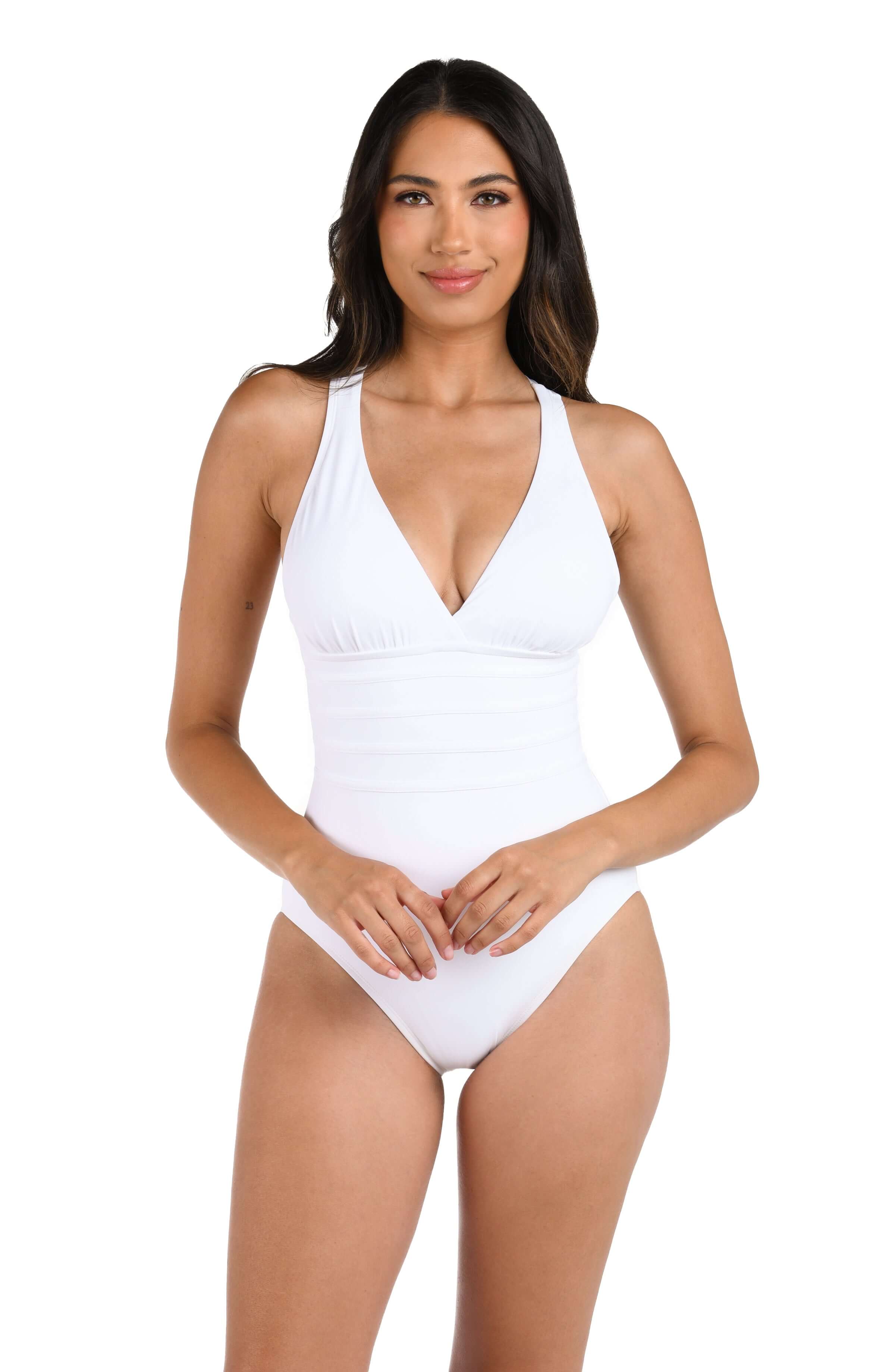 Woman wearing a white swimsuit on a white background