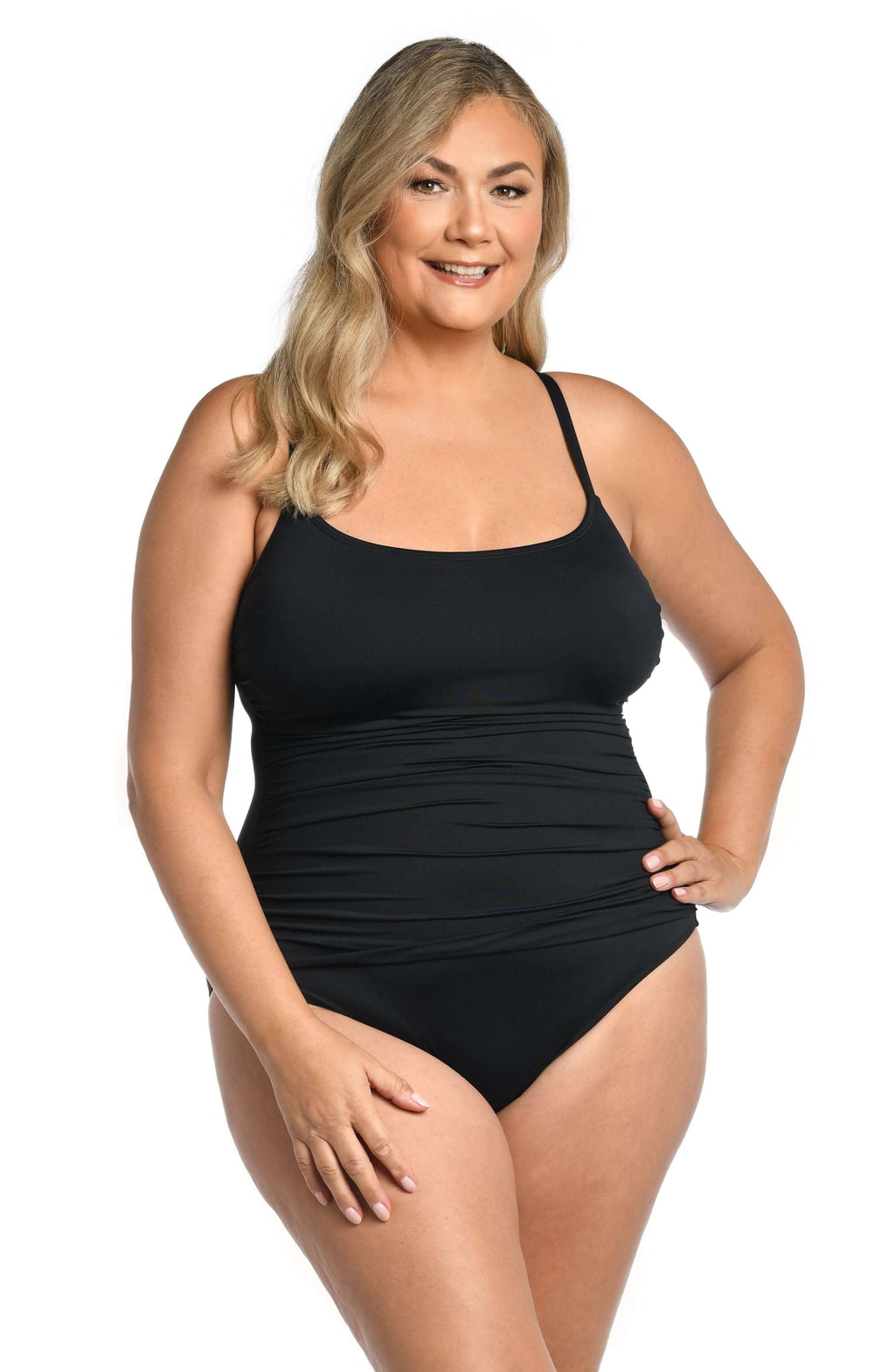 Woman wearing a black swimsuit against a white background