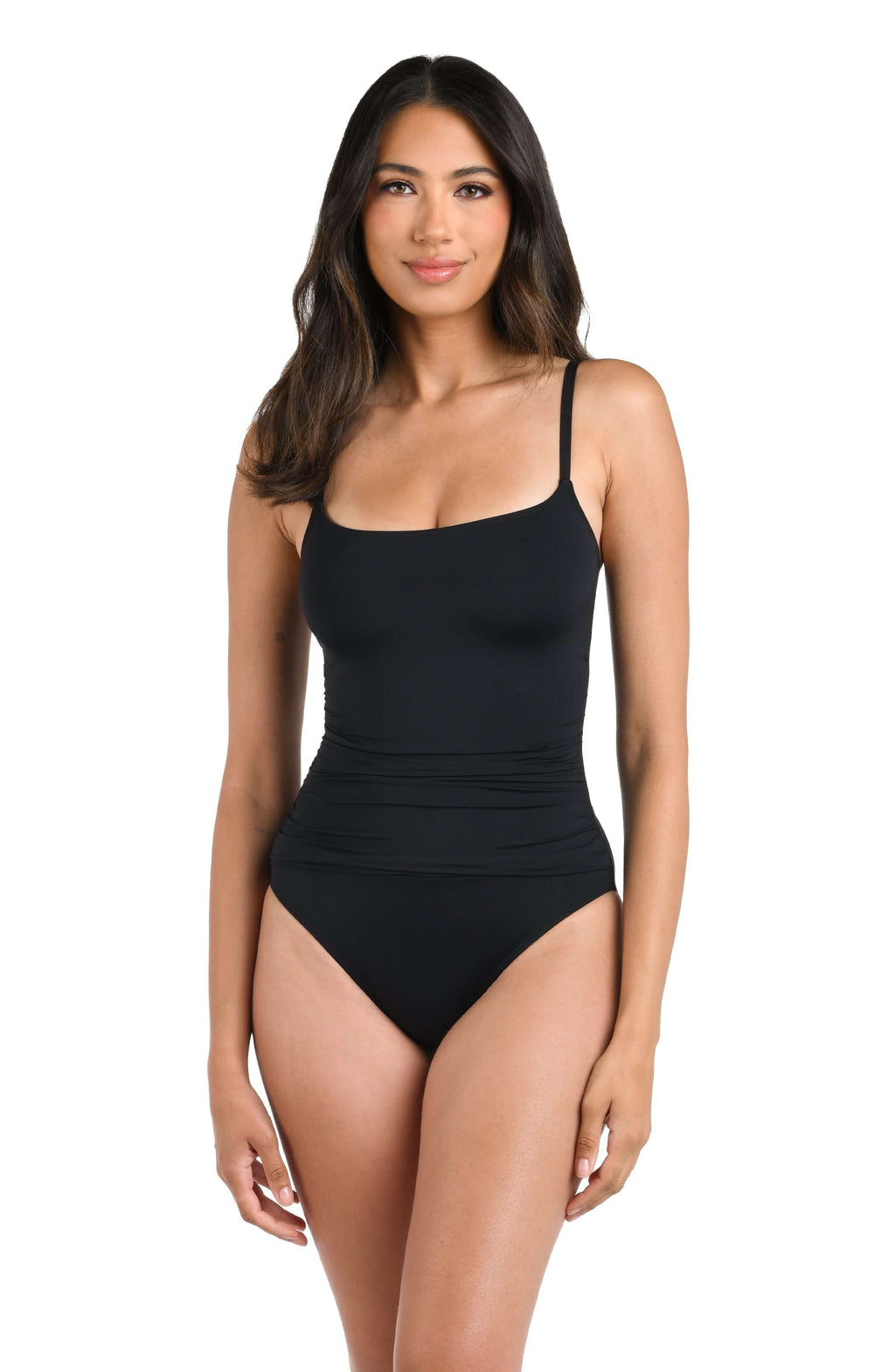 Woman wearing a black swimsuit against a white background