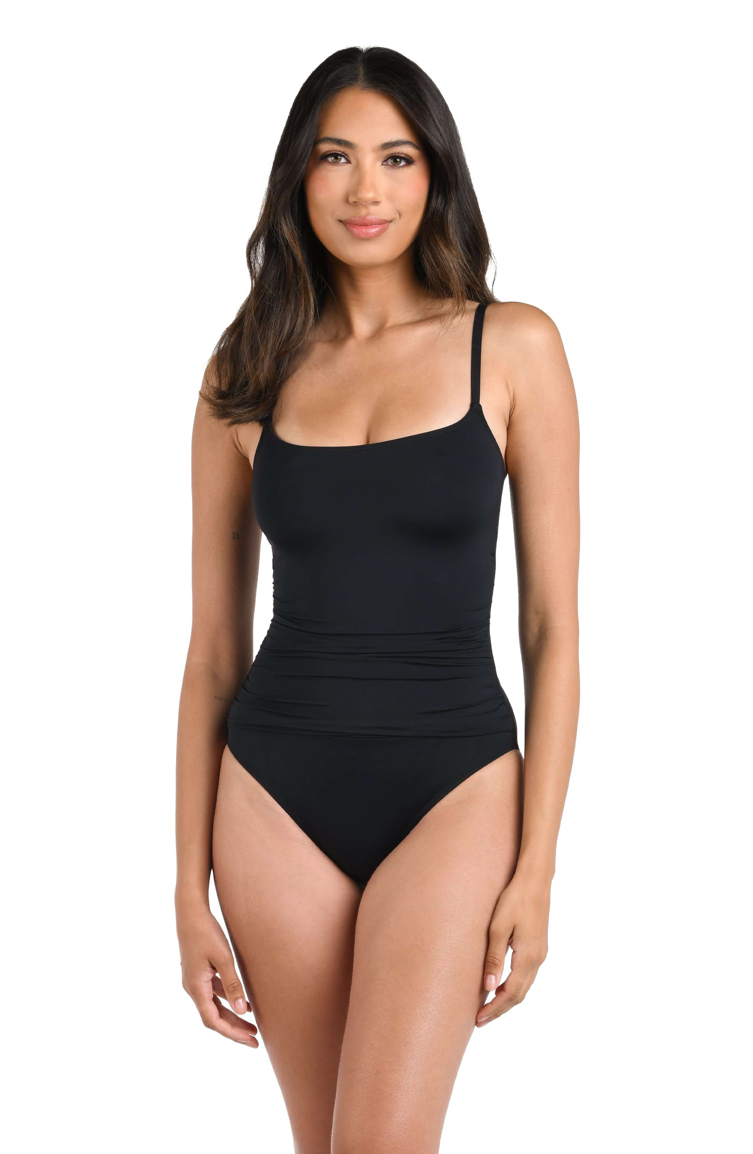 Woman wearing a black swimsuit against a white background