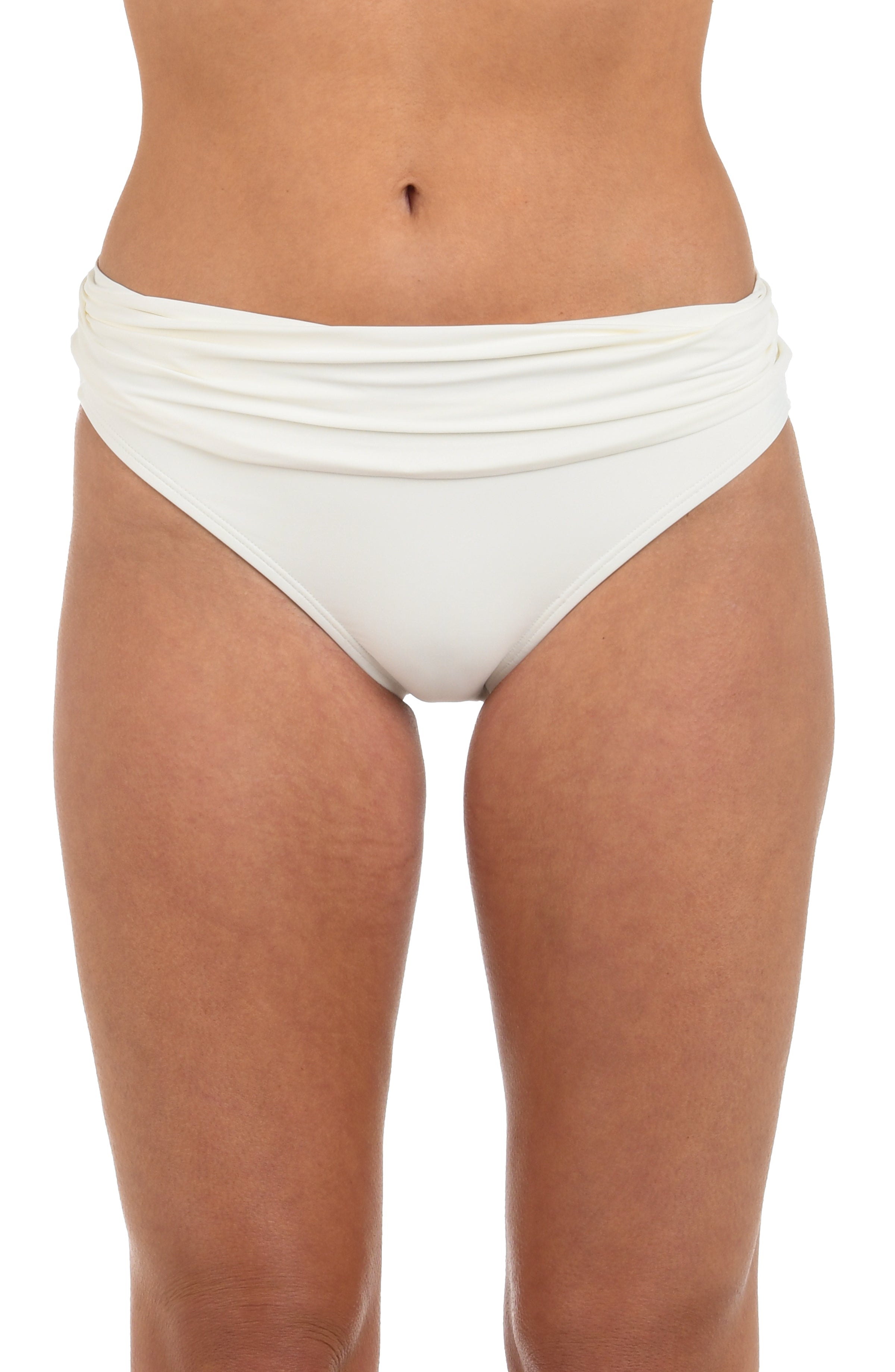 Front image of model wearing an ivory colored hipster bikini bottom featuring fold-over shirred banding. 