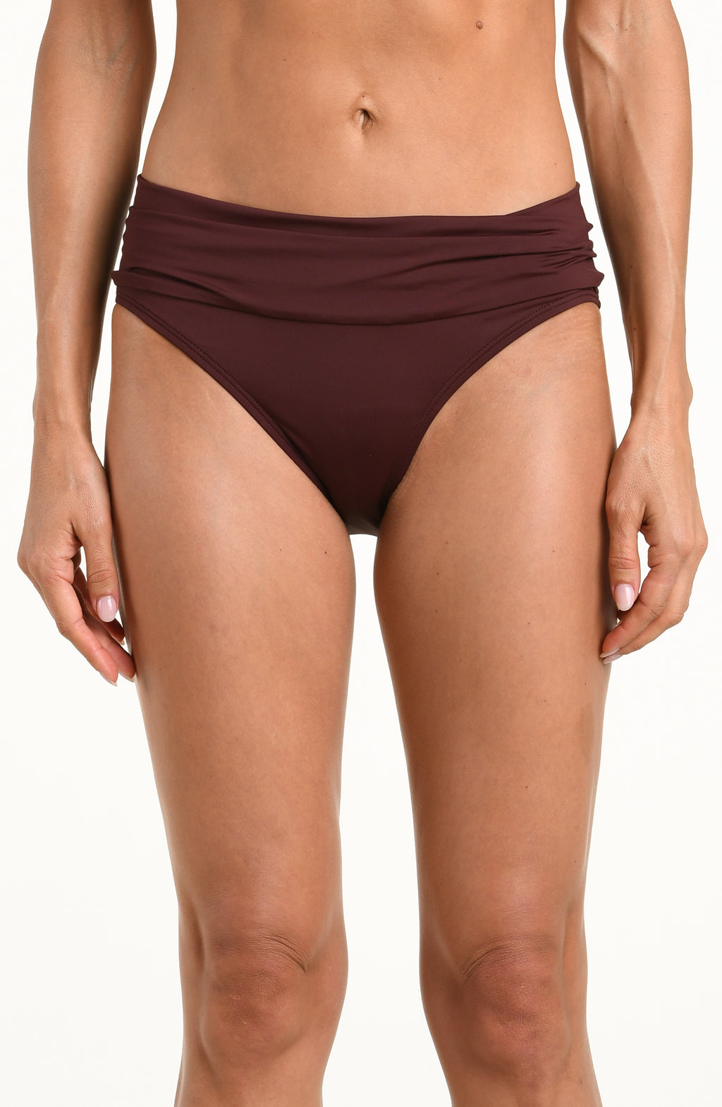 Woman wearing a solid java brown bikini bottom with a front sash against a white background. 