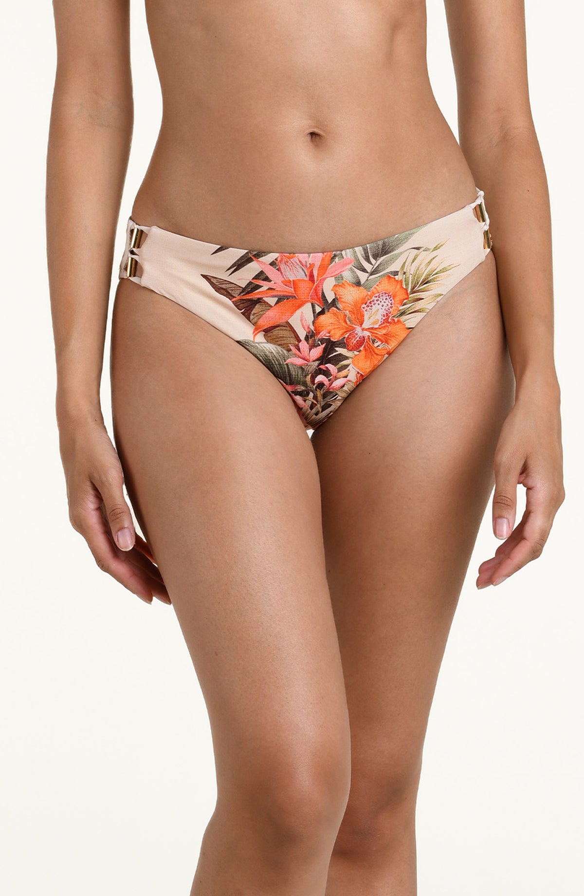 Woman wearing a multicolored white bikini bottom against a white background. 