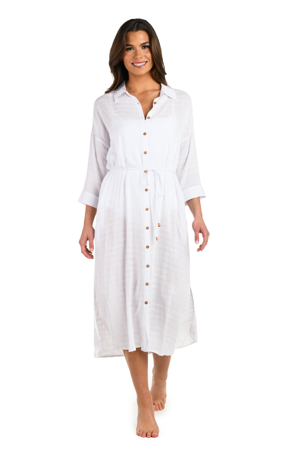 Woman wearing a white button-up dress on a white background