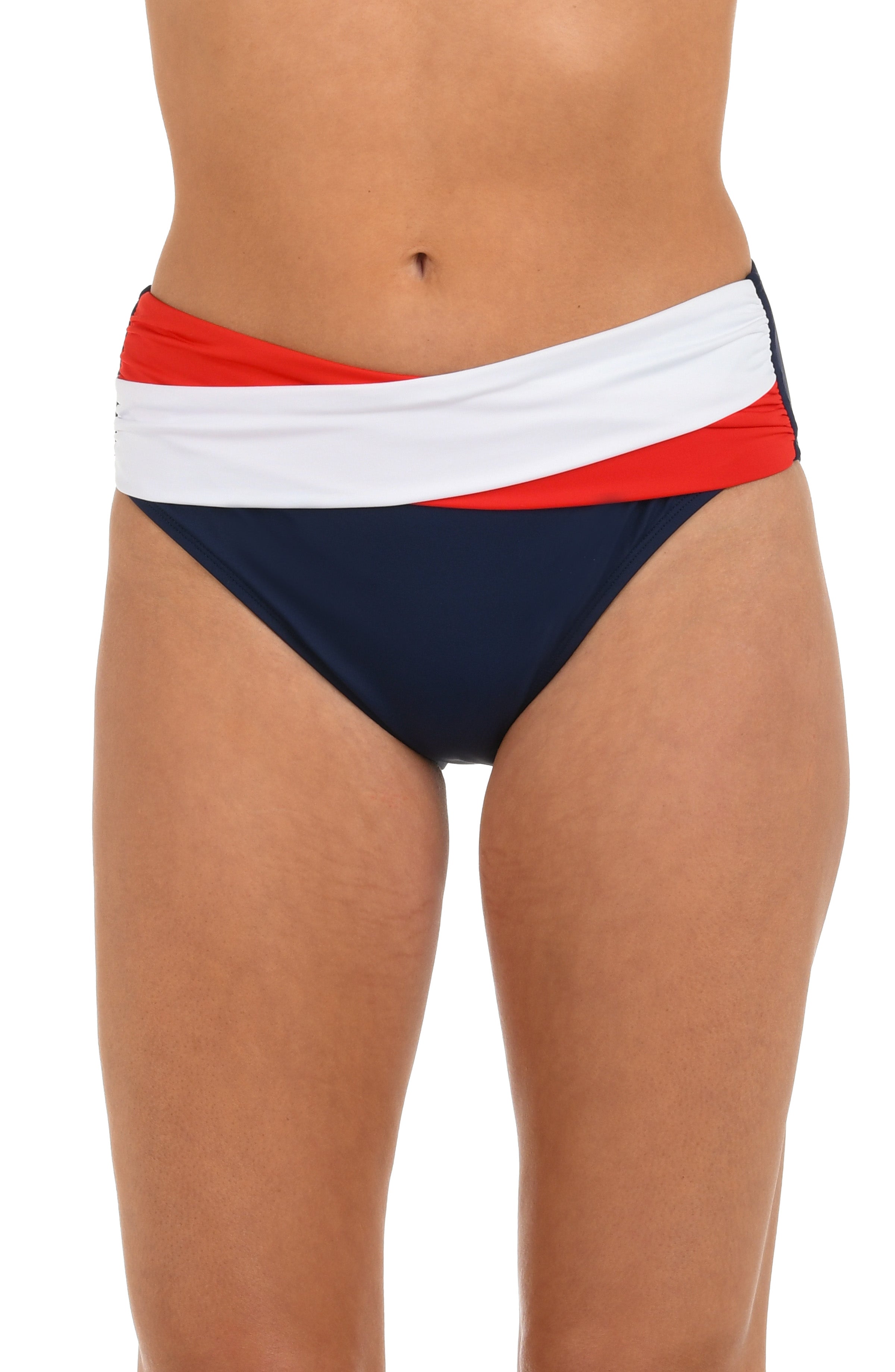 Woman wearing a red, white, and blue mid-waist bikini bottom against a white background.
