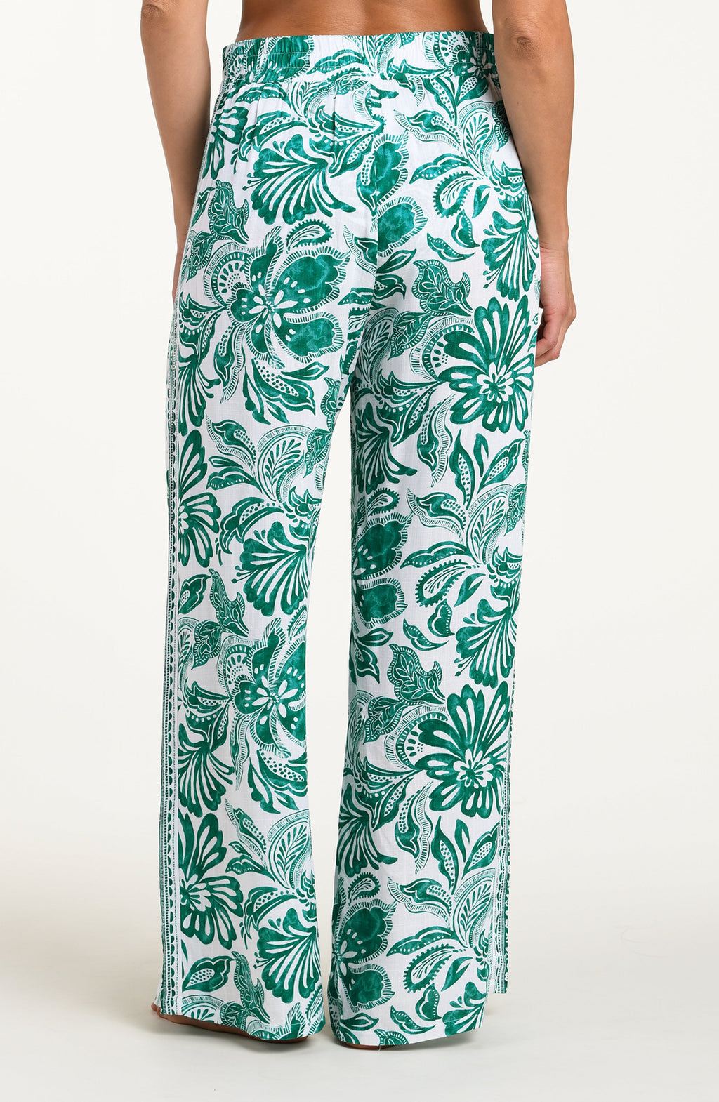 Green and white patterned pants on a white background