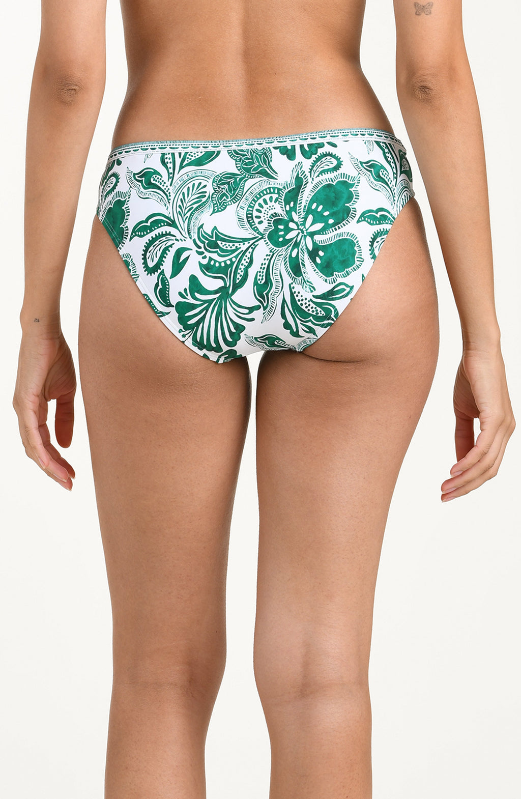 Green and white patterned bikini bottom on a plain background