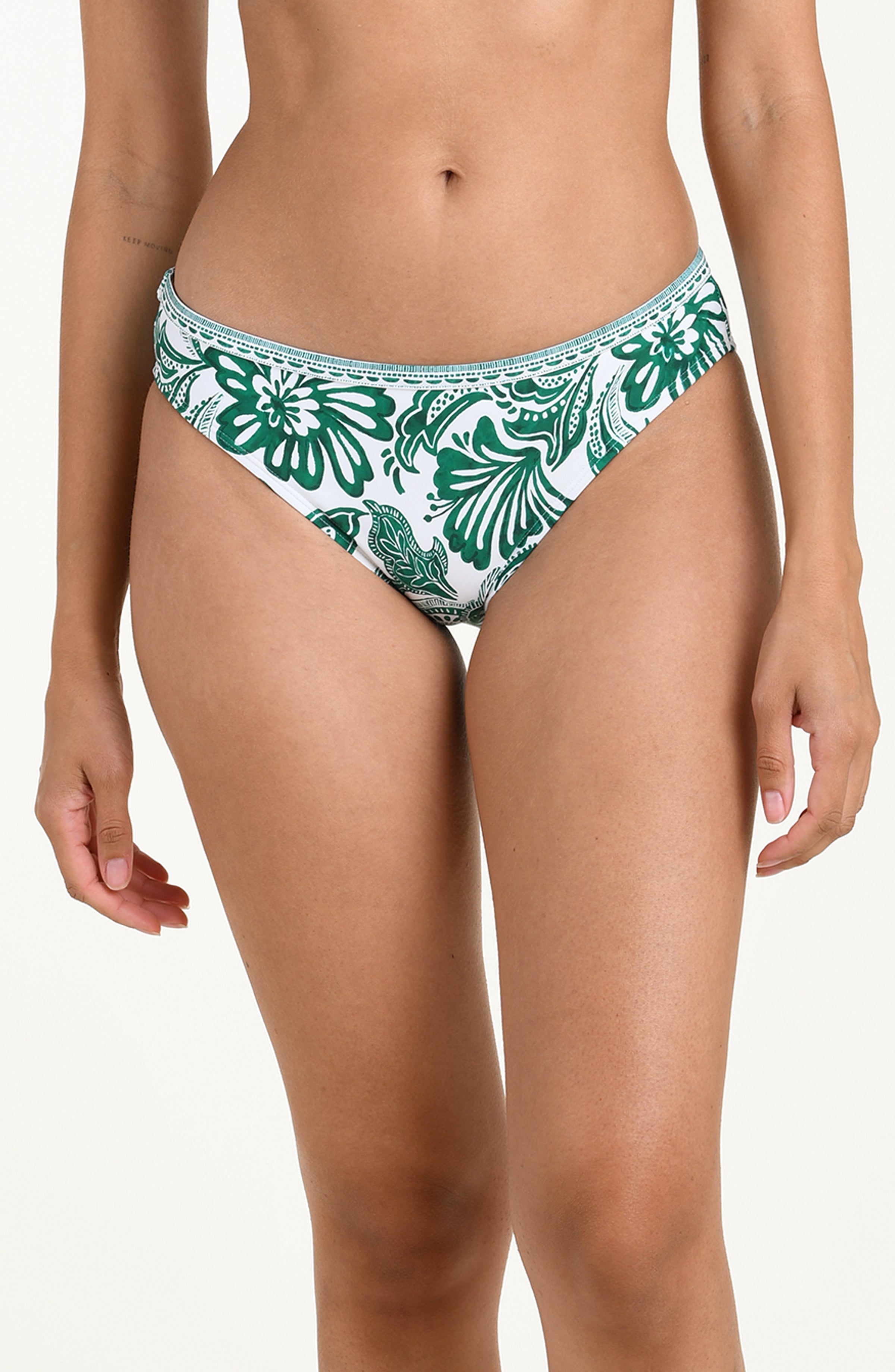 Green and white floral-patterned bikini bottom on a white background