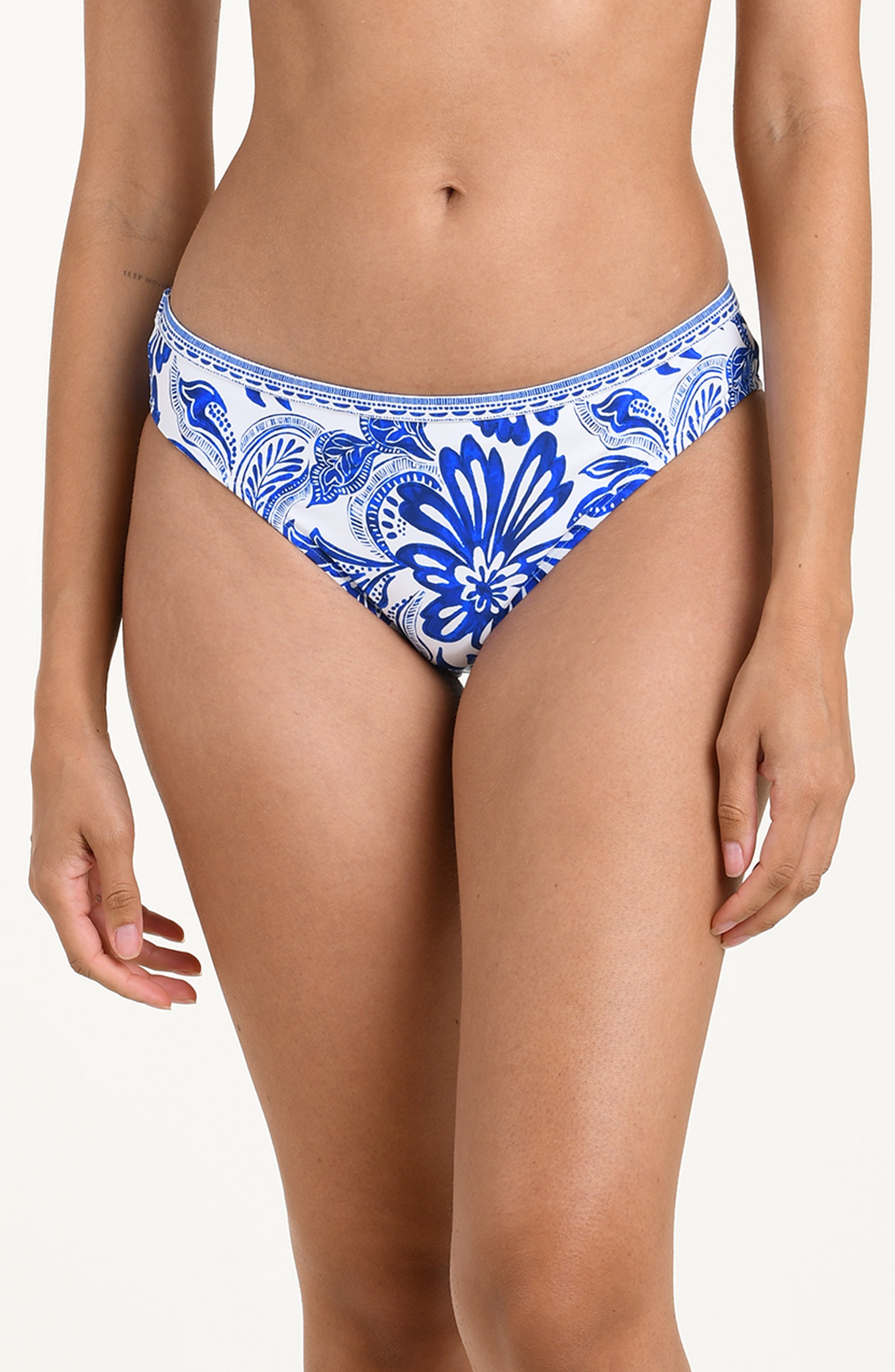 Blue and white patterned bikini bottom on a plain background