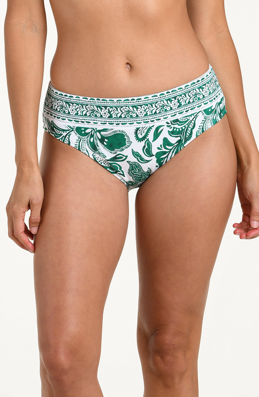 Green and white patterned bikini bottom on a plain background