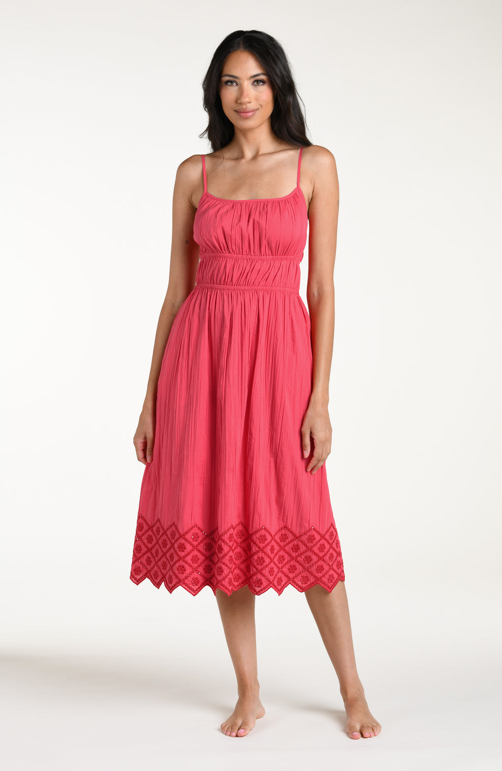Woman wearing a guava colored midi cover up dress against a white background