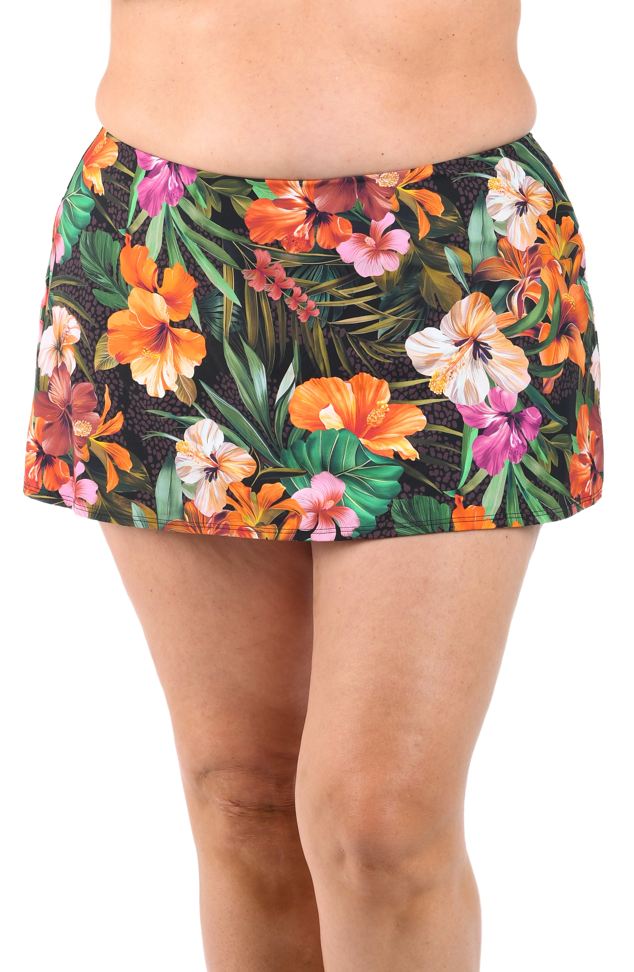 Tropical floral skirt worn by a person on a white background