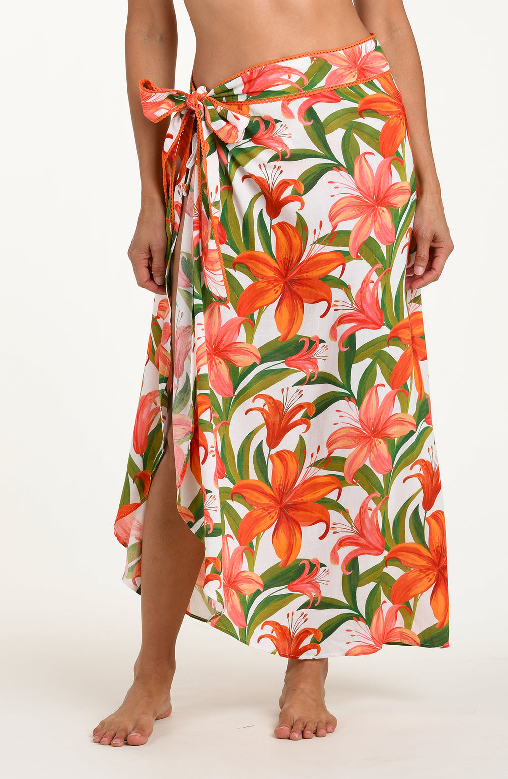 Floral patterned pareo wrap with orange and pink flowers on a white background
