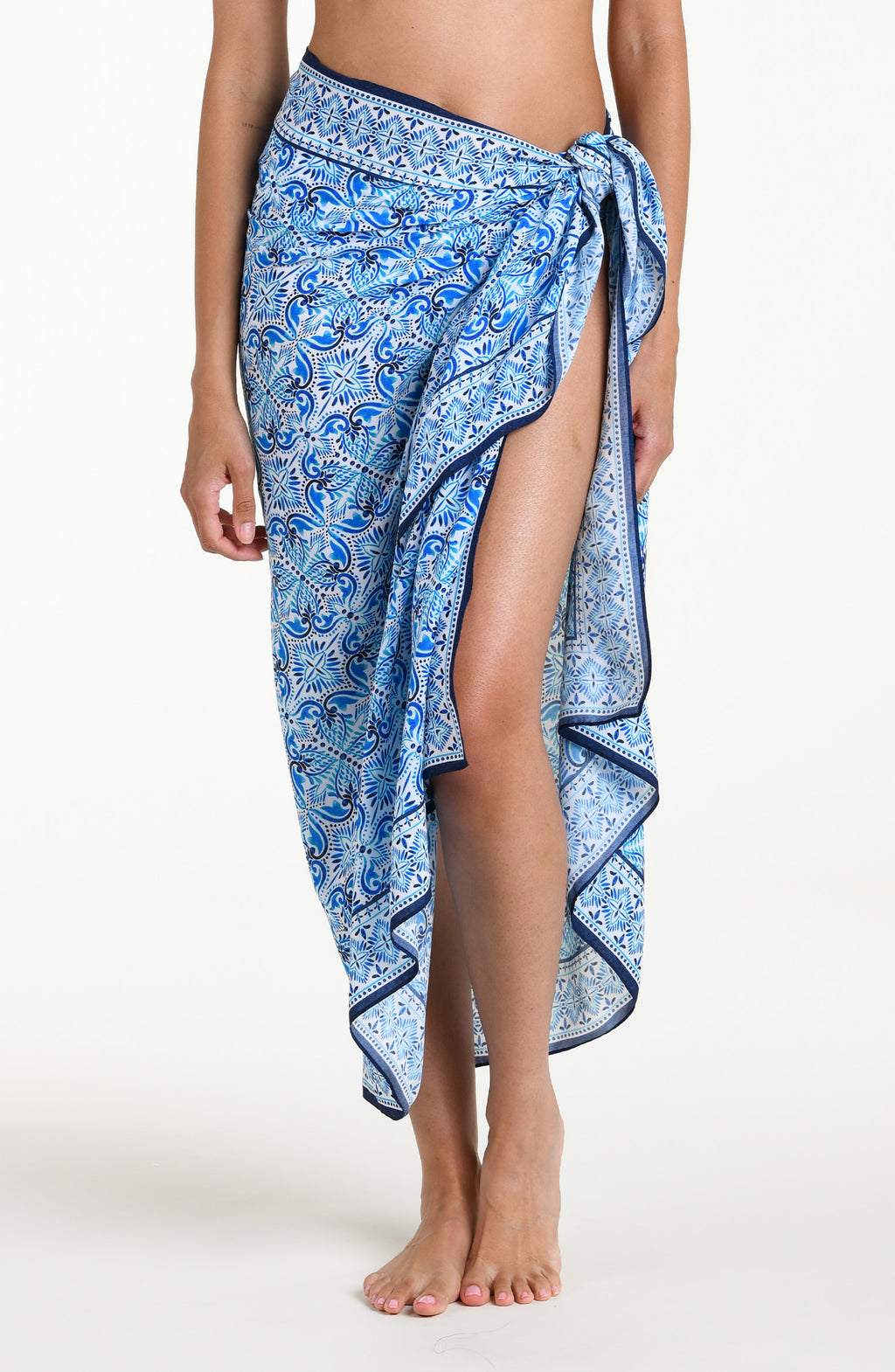 Blue floral patterned pareo wrap against a white background