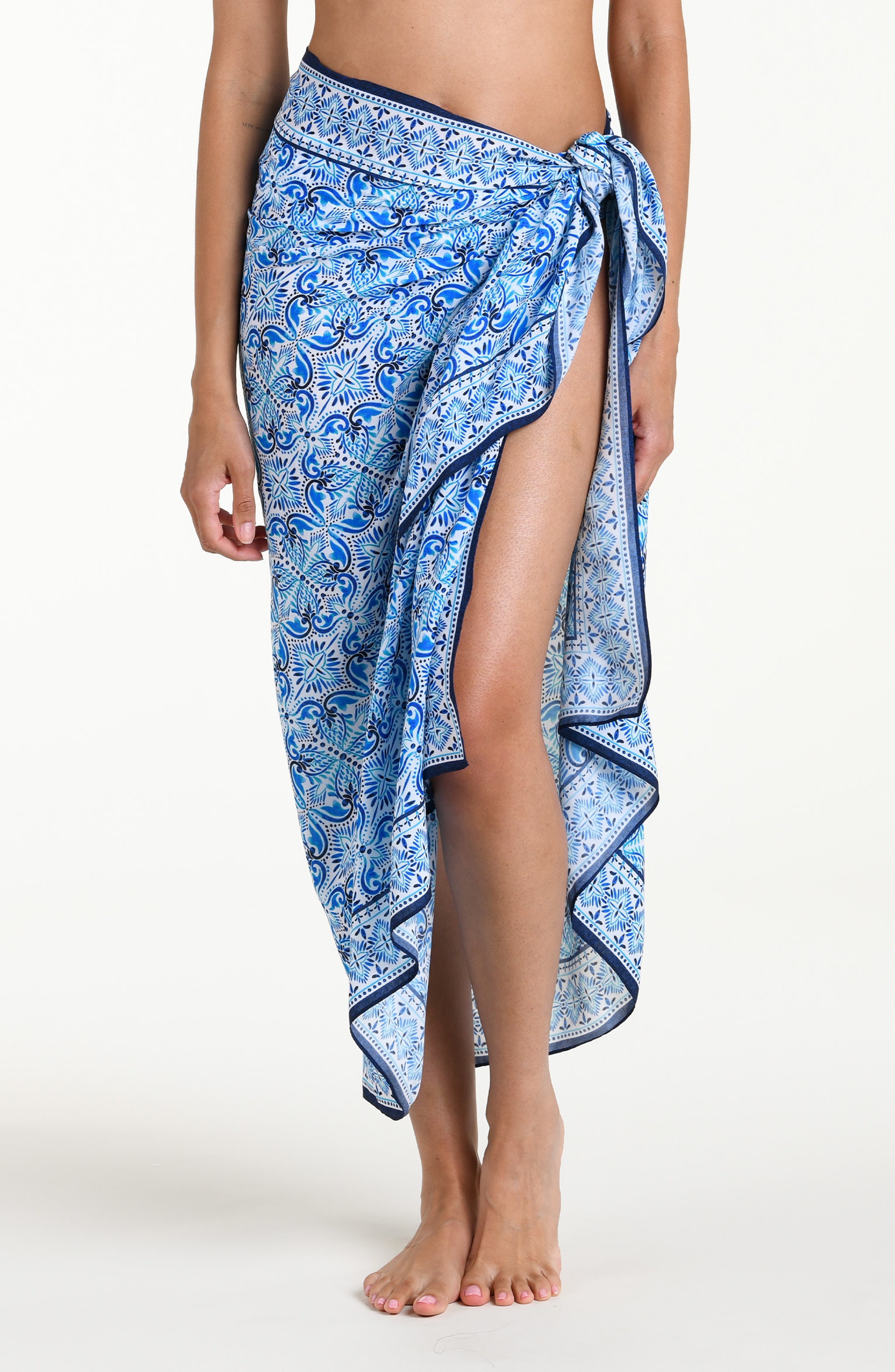 Blue floral patterned pareo wrap against a white background