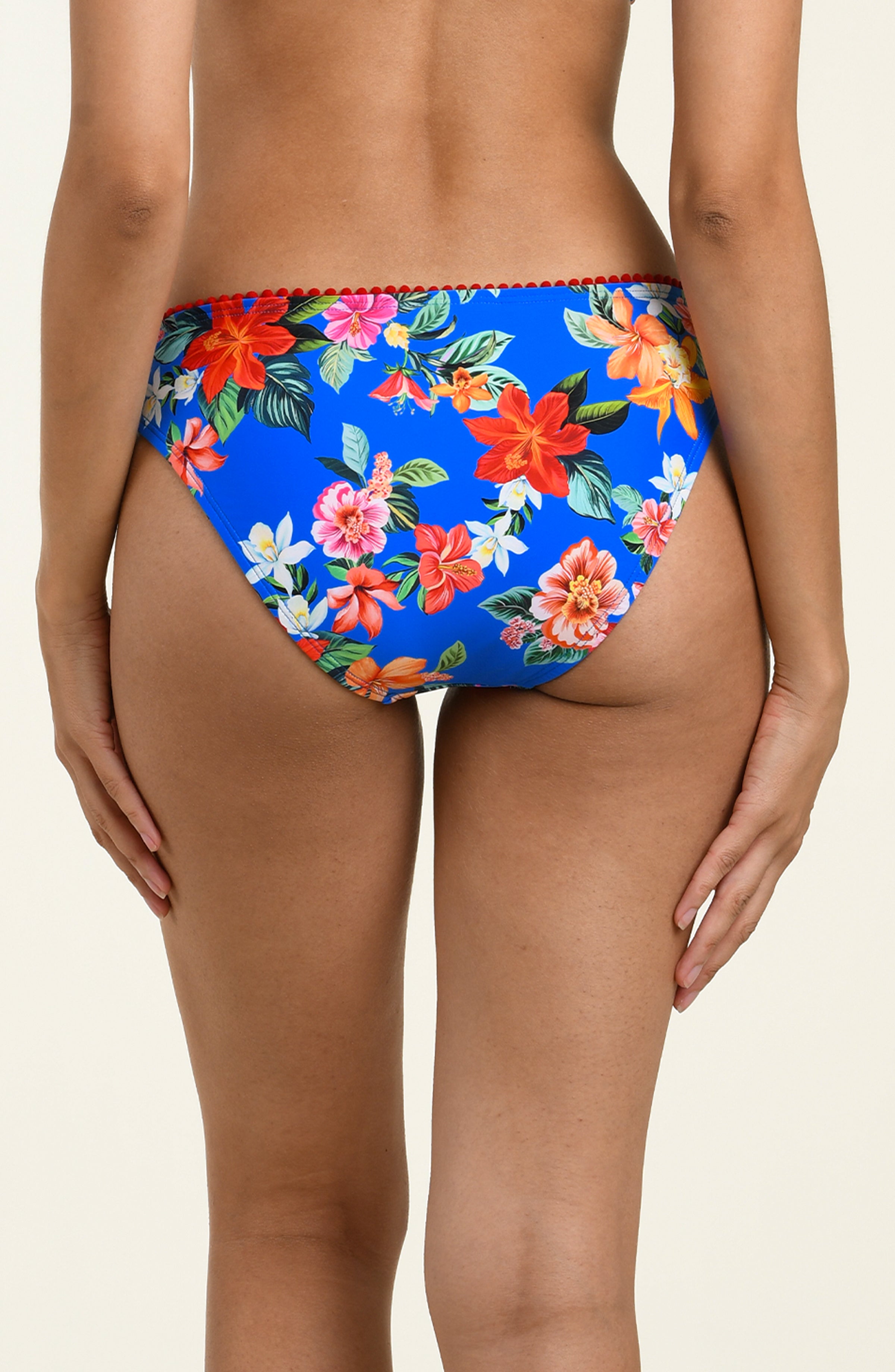 Blue floral bikini bottom on a beige background