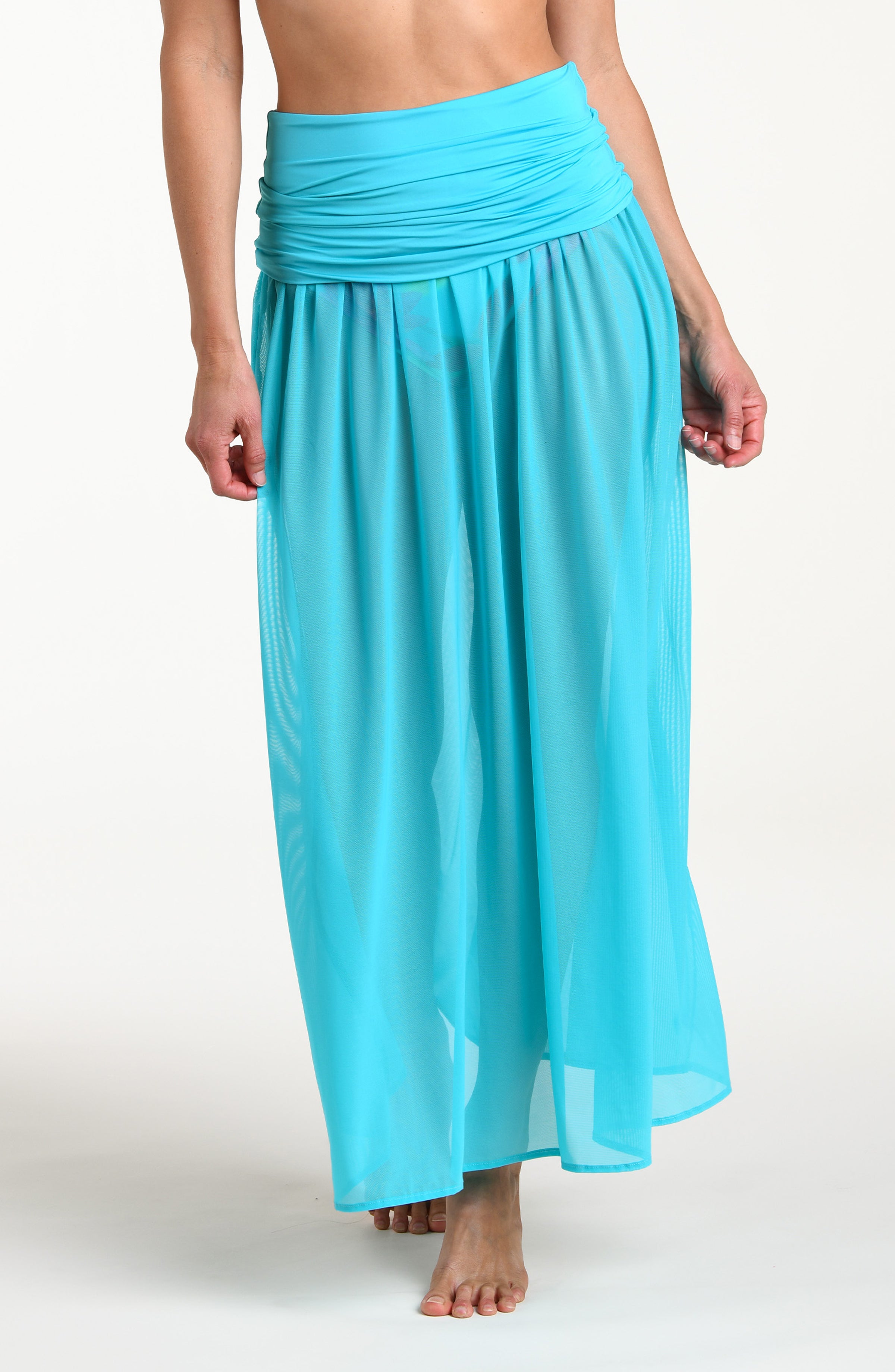 Turquoise skirt worn by a person on a white background