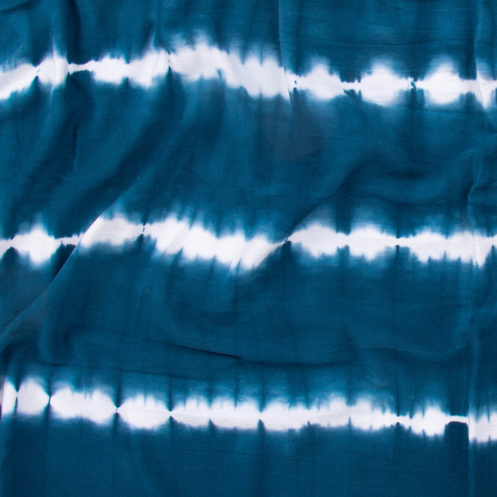 Close-up of a teal colored beach towel by Layday.