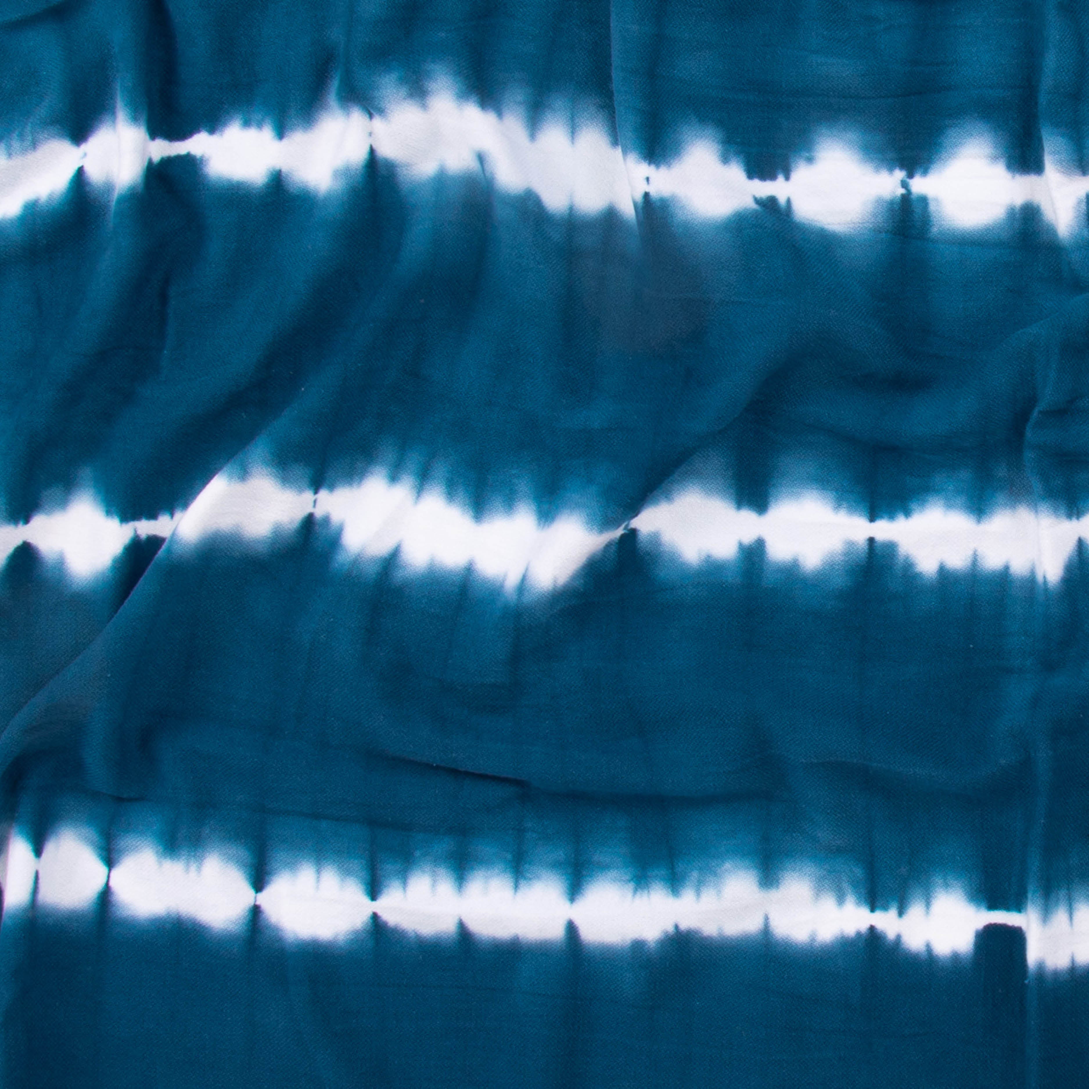 Close-up of a teal colored beach towel by Layday.