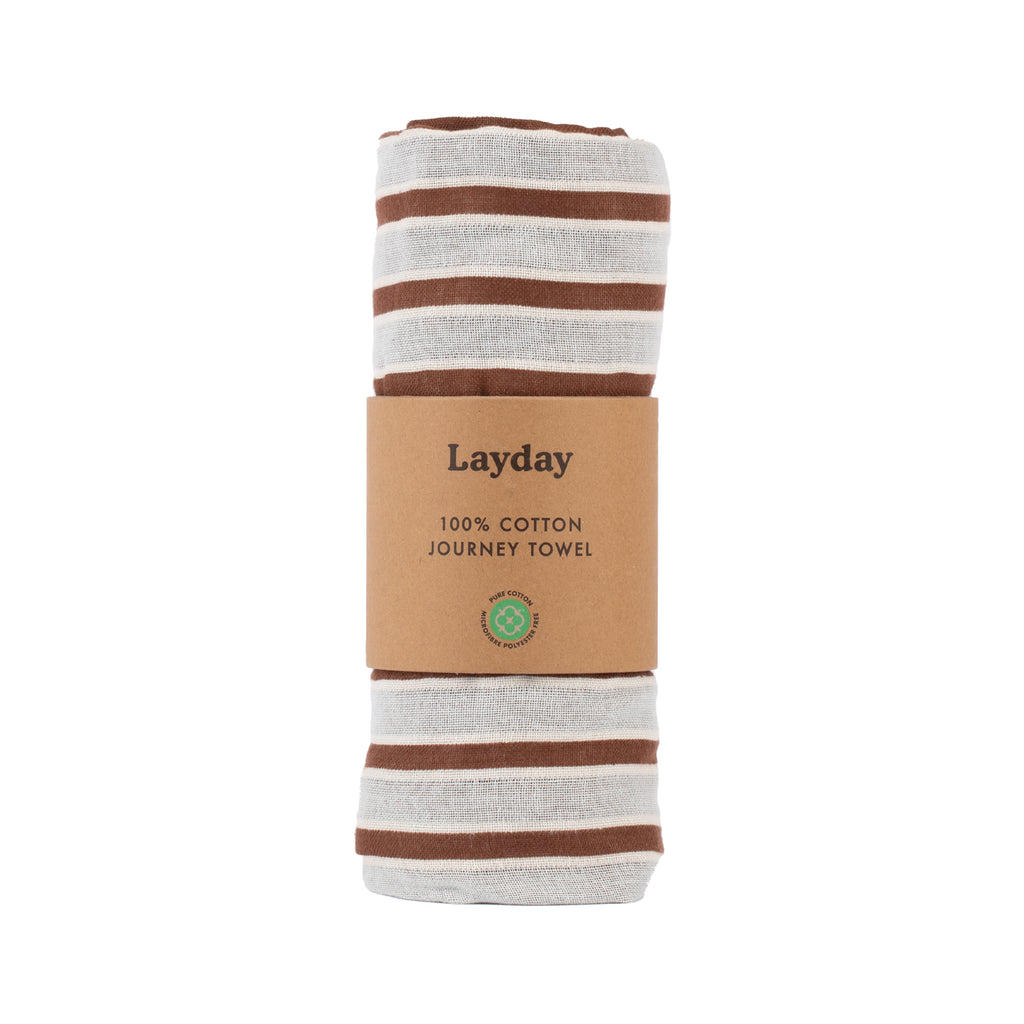 Brown and beige striped beach towel by Layday.