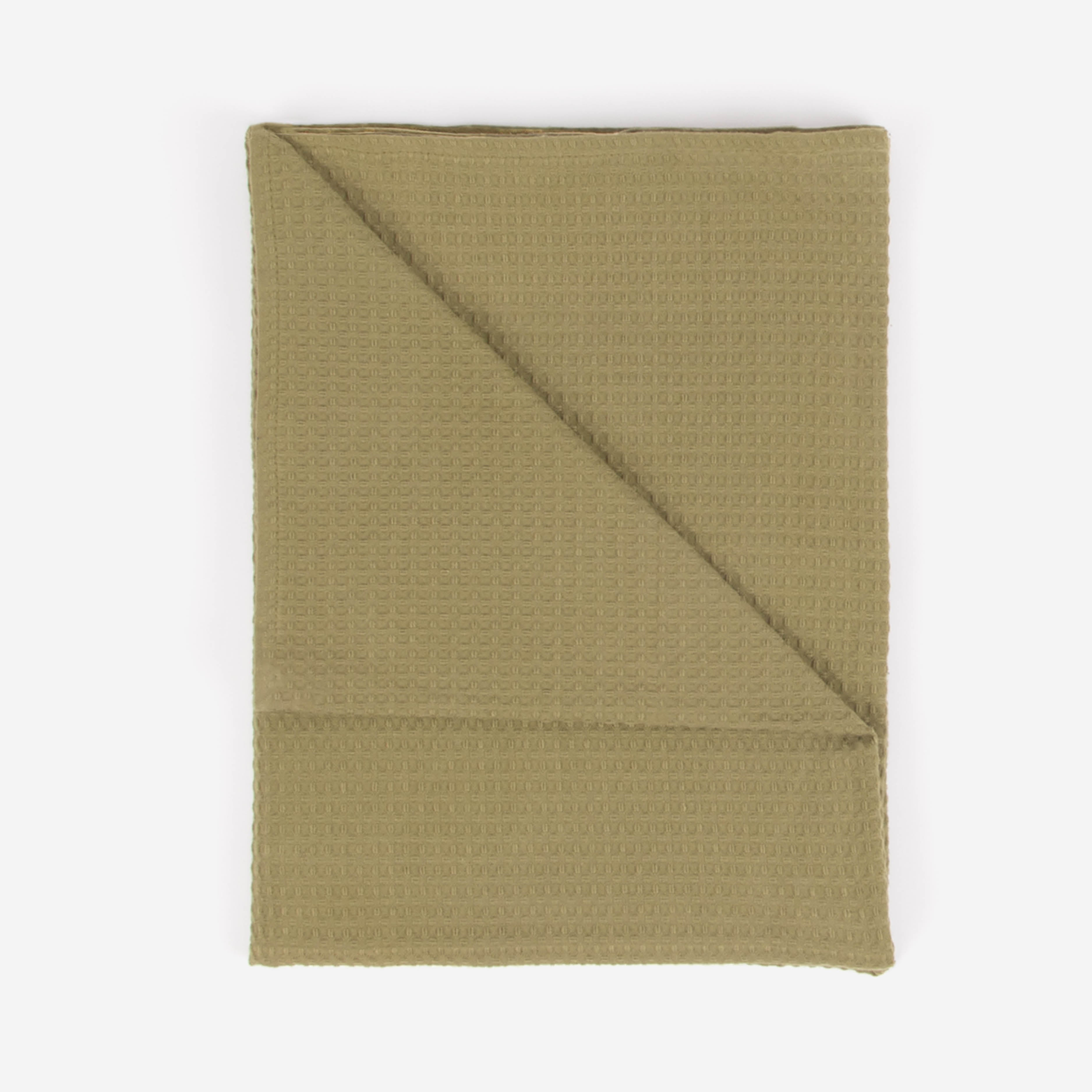 An olive green colored beach towel by Layday