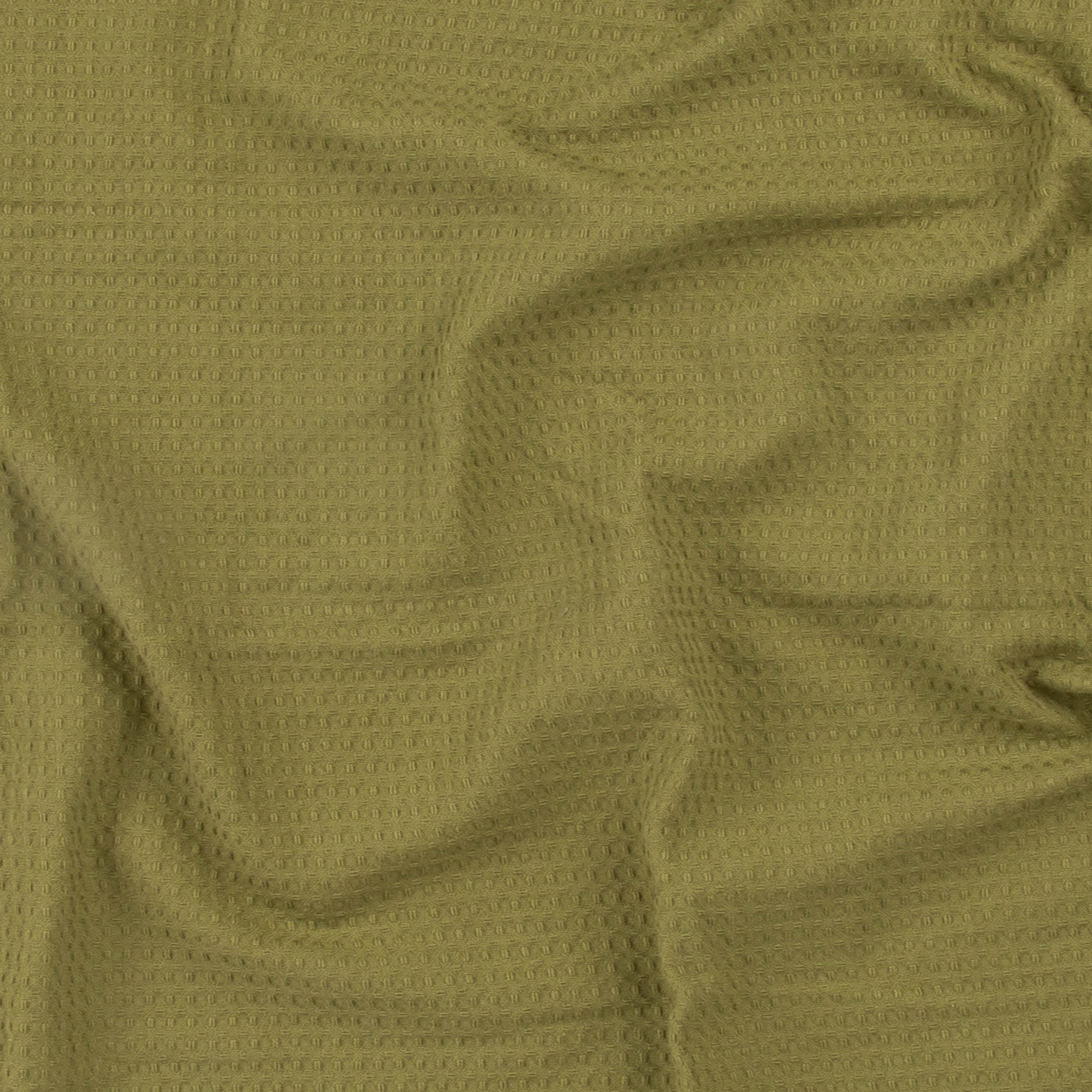 Close-up of an olive green colored beach towel by Layday