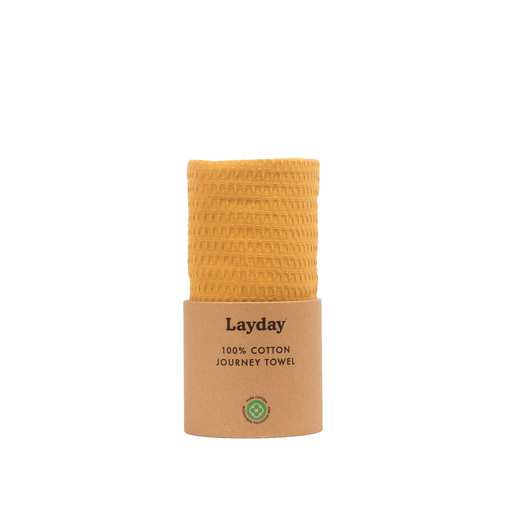 A honey colored beach towel by Layday