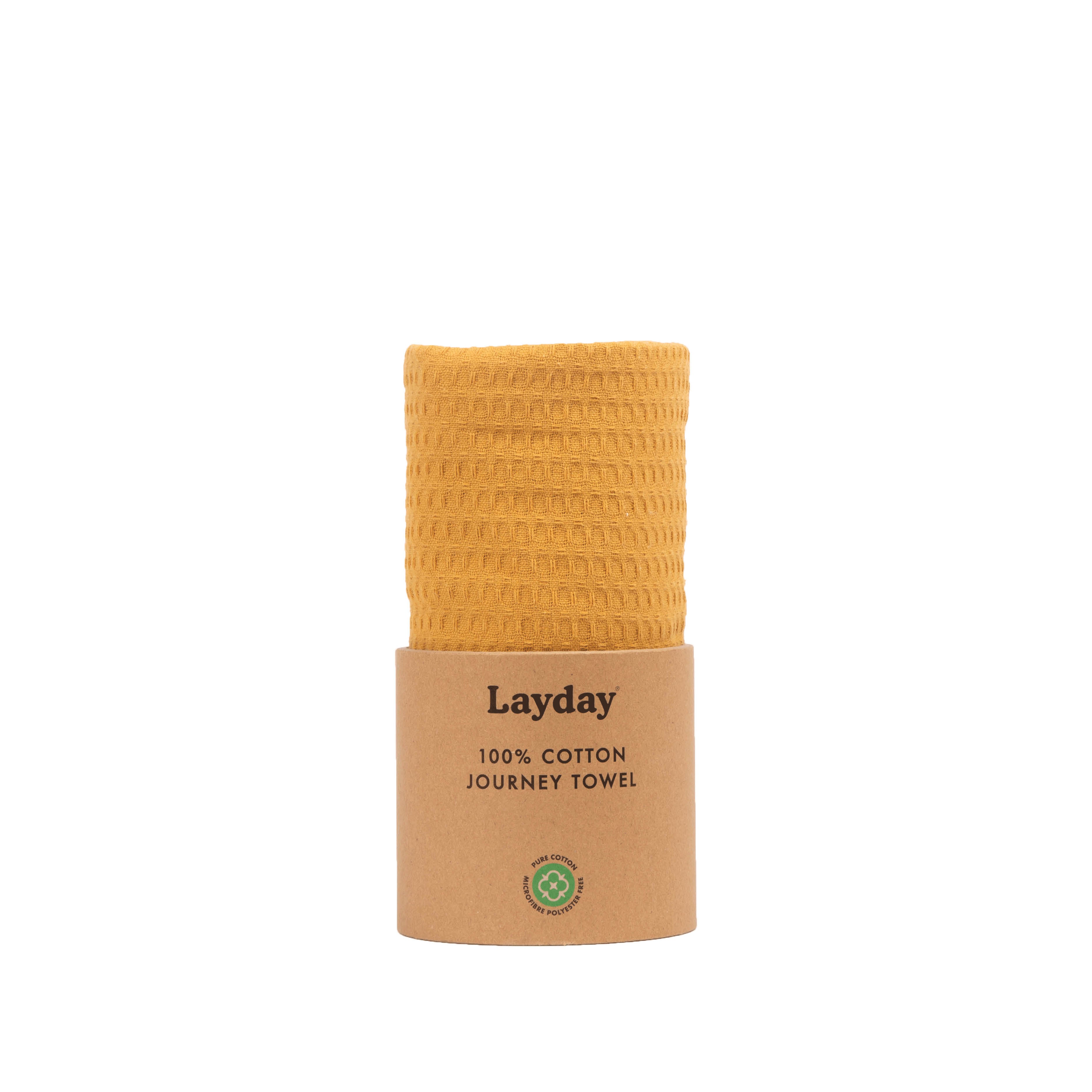 A honey colored beach towel by Layday