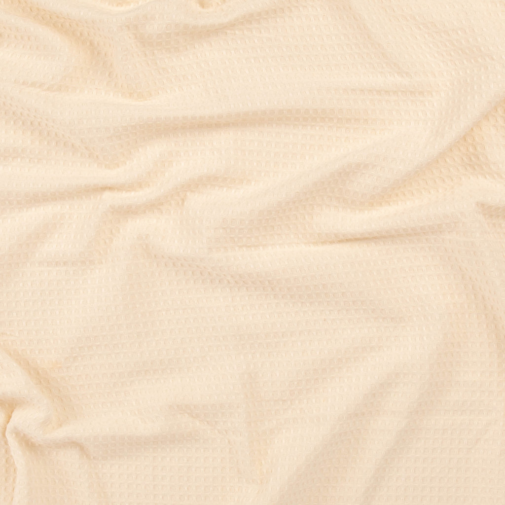 Close-up of a sand colored beach towel from Layday