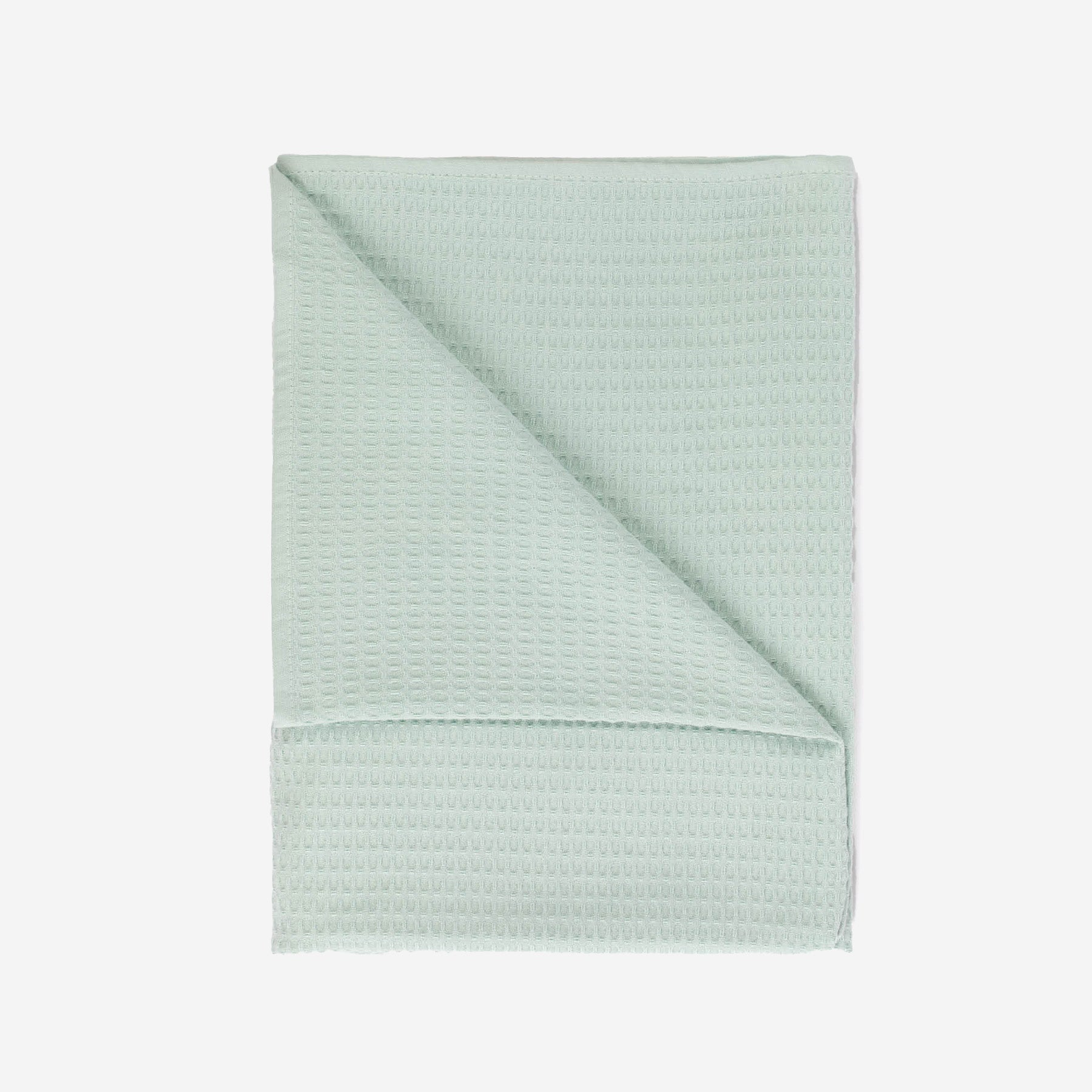 A mint colored beach towel by Layday