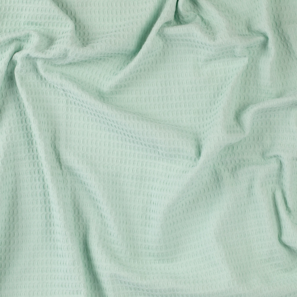 Close-up of a mint colored beach towel by Layday