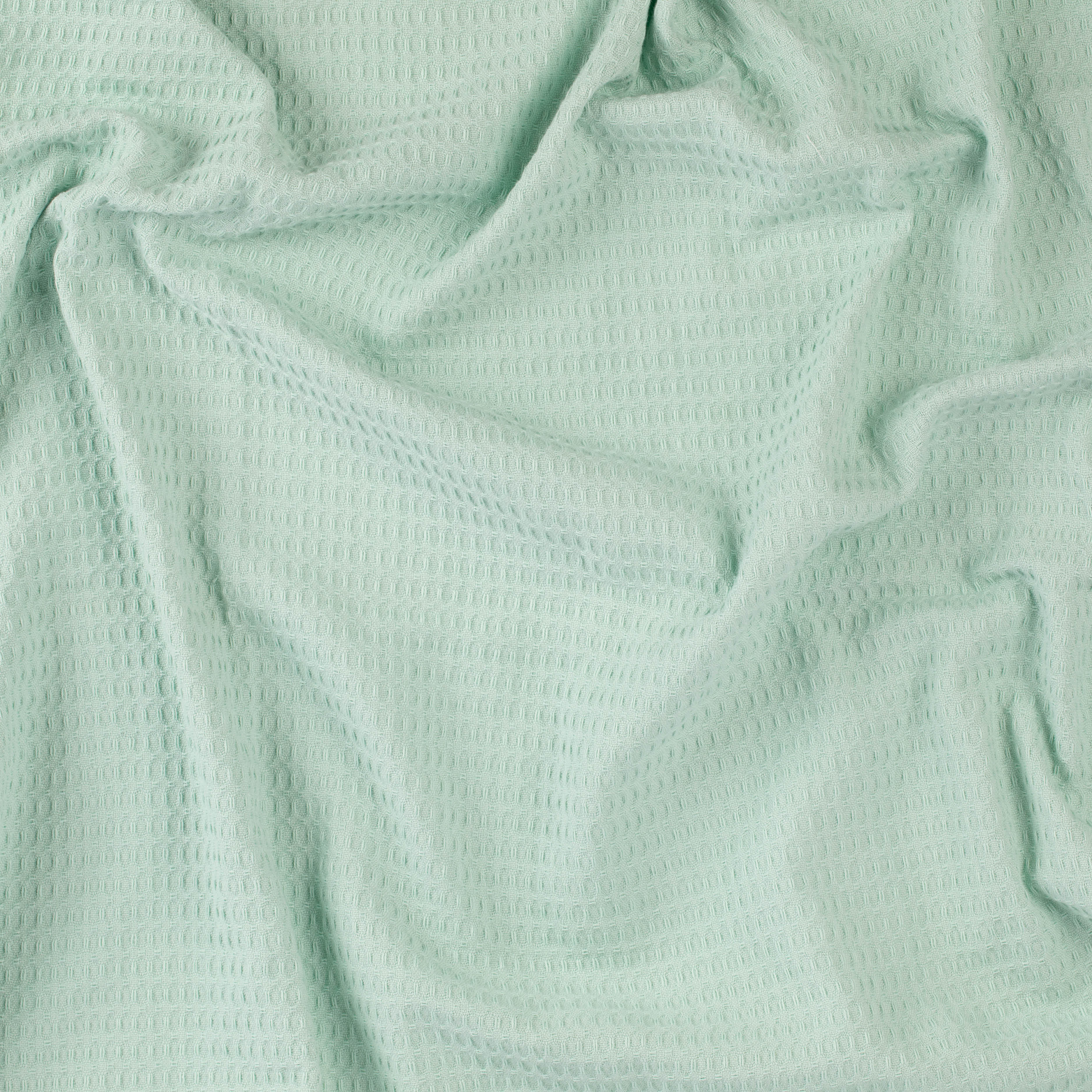 Close-up of a mint colored beach towel by Layday