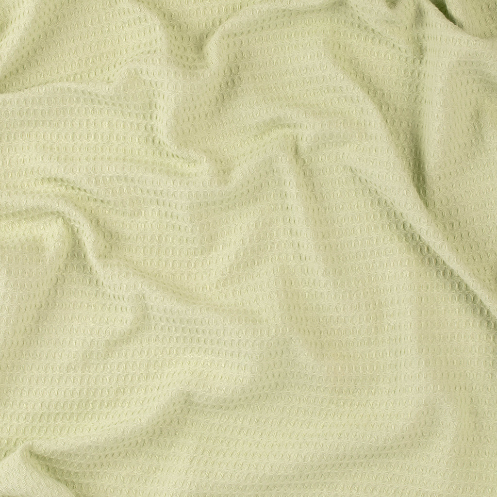 Close-up of a Sage colored beach towel by Layday