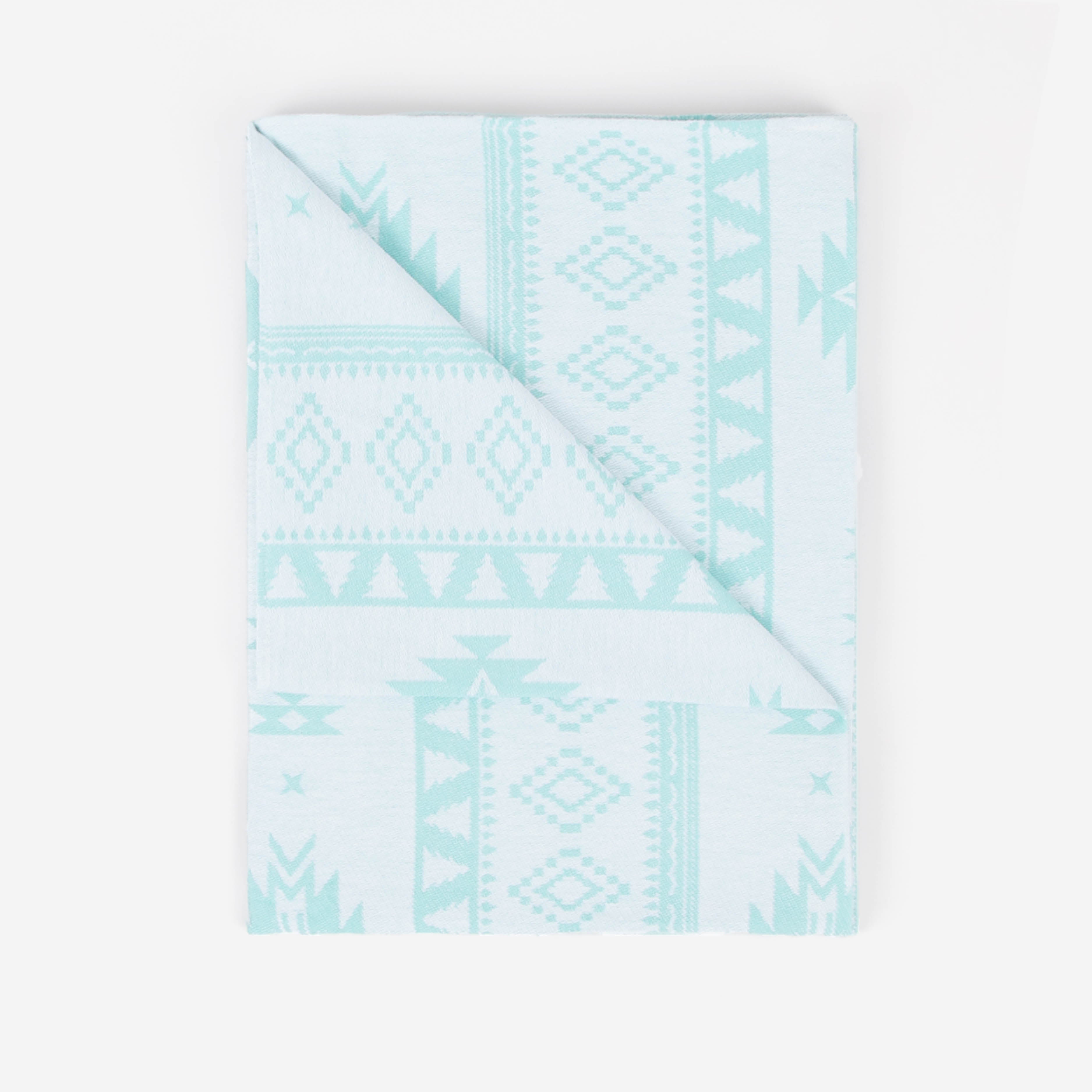 Light blue patterned fabric on a white background