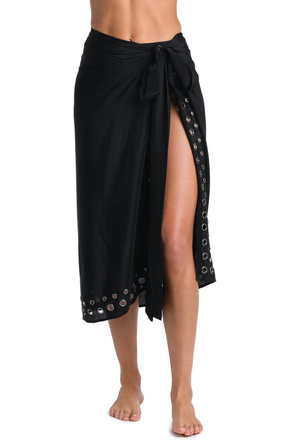 A black wrap sarong skirt with a side slit and silver-tone grommet details, shown on a model against a white background.