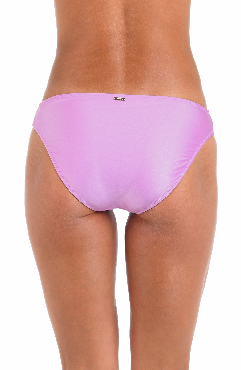 Woman wearing a light purple colored bikini bottom against a white background.