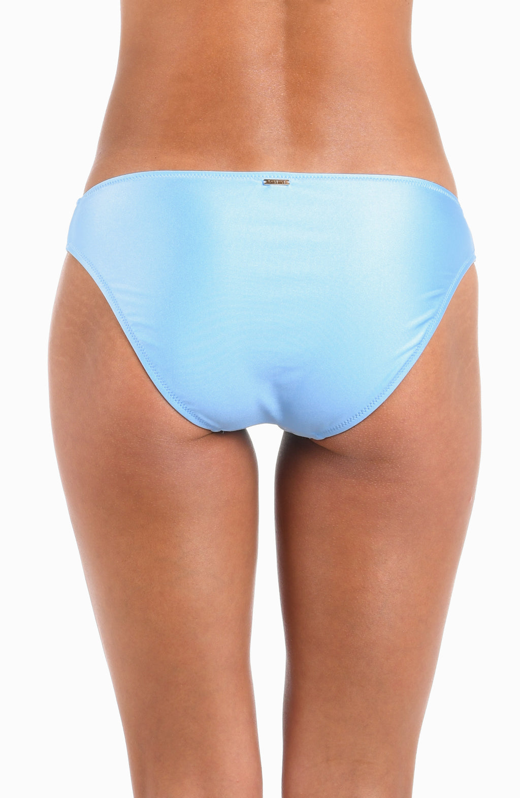 Rear view of a model wearing light blue bikini bottoms against a plain white background.