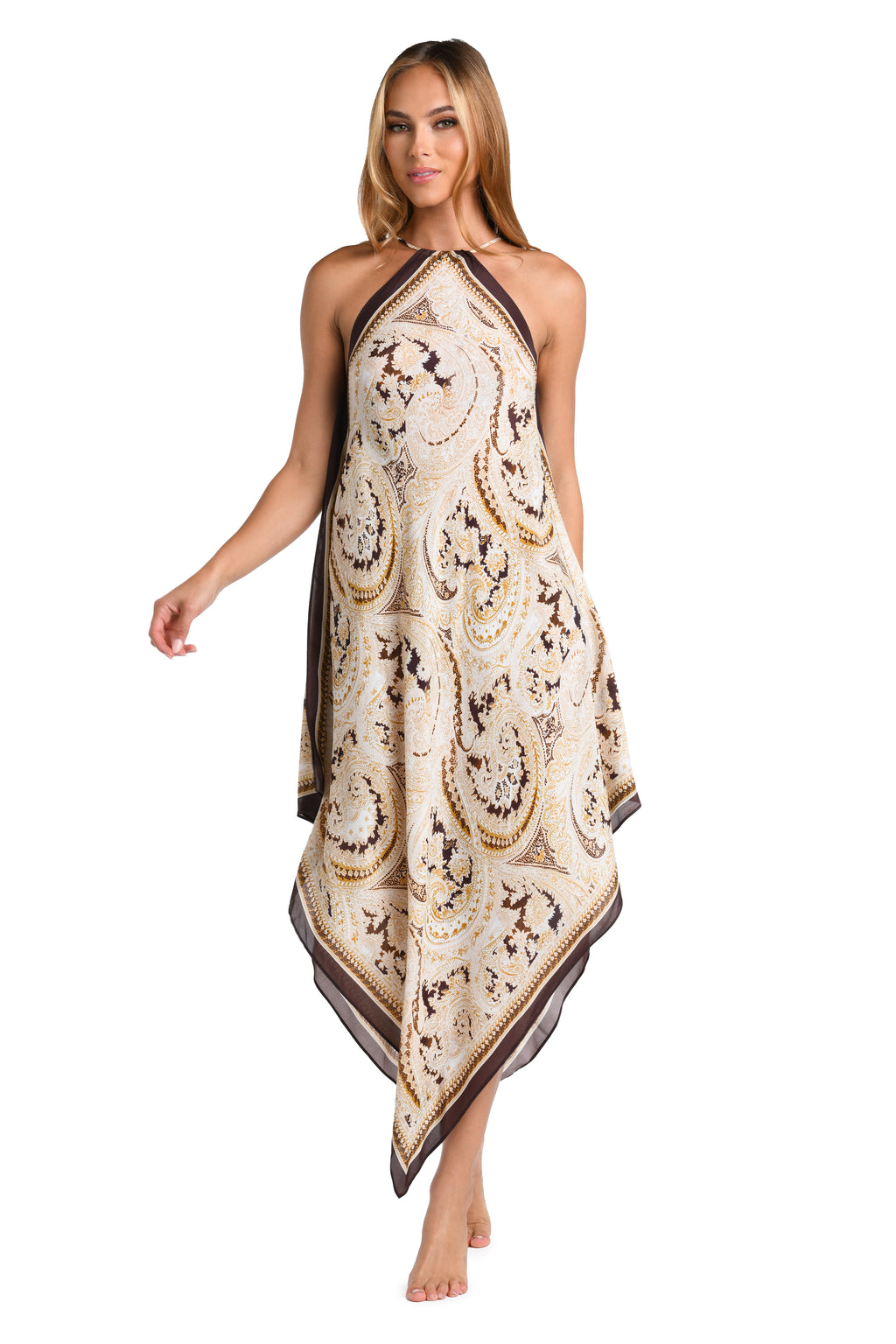 Woman wearing a brown multicolored midi dress cover up against a white background. 