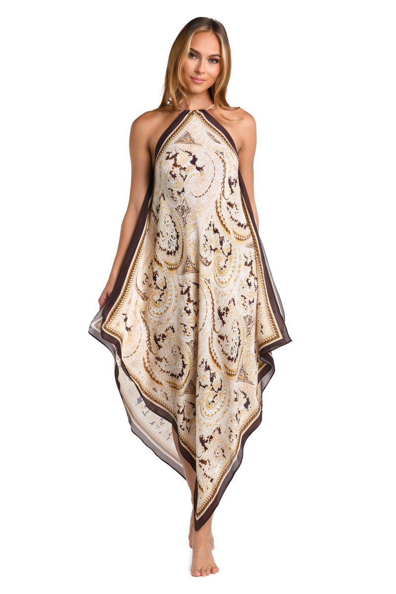 Woman wearing a brown multicolored midi dress cover up against a white background. 