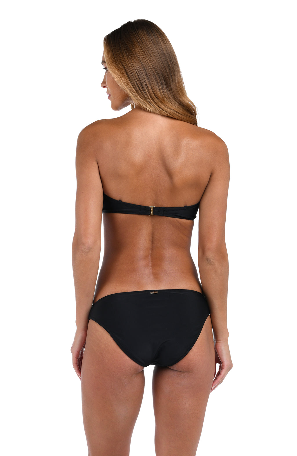 Woman wearing a black bikini on a white background