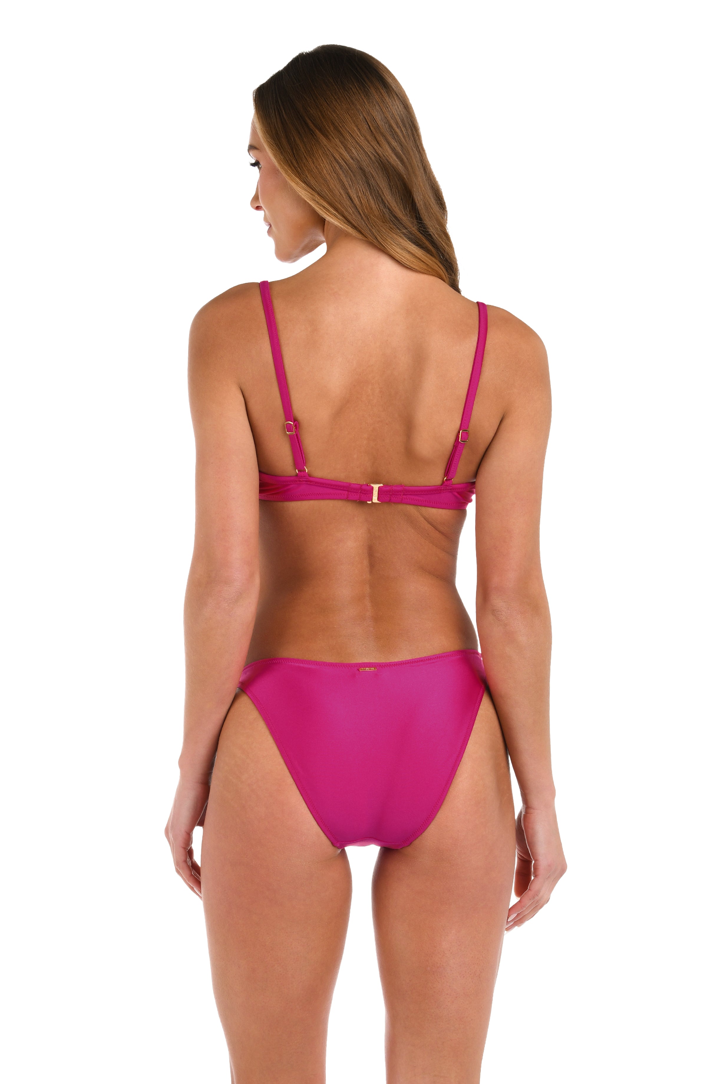 Woman wearing a fuchsia bikini top and matching bottom against a white background. 