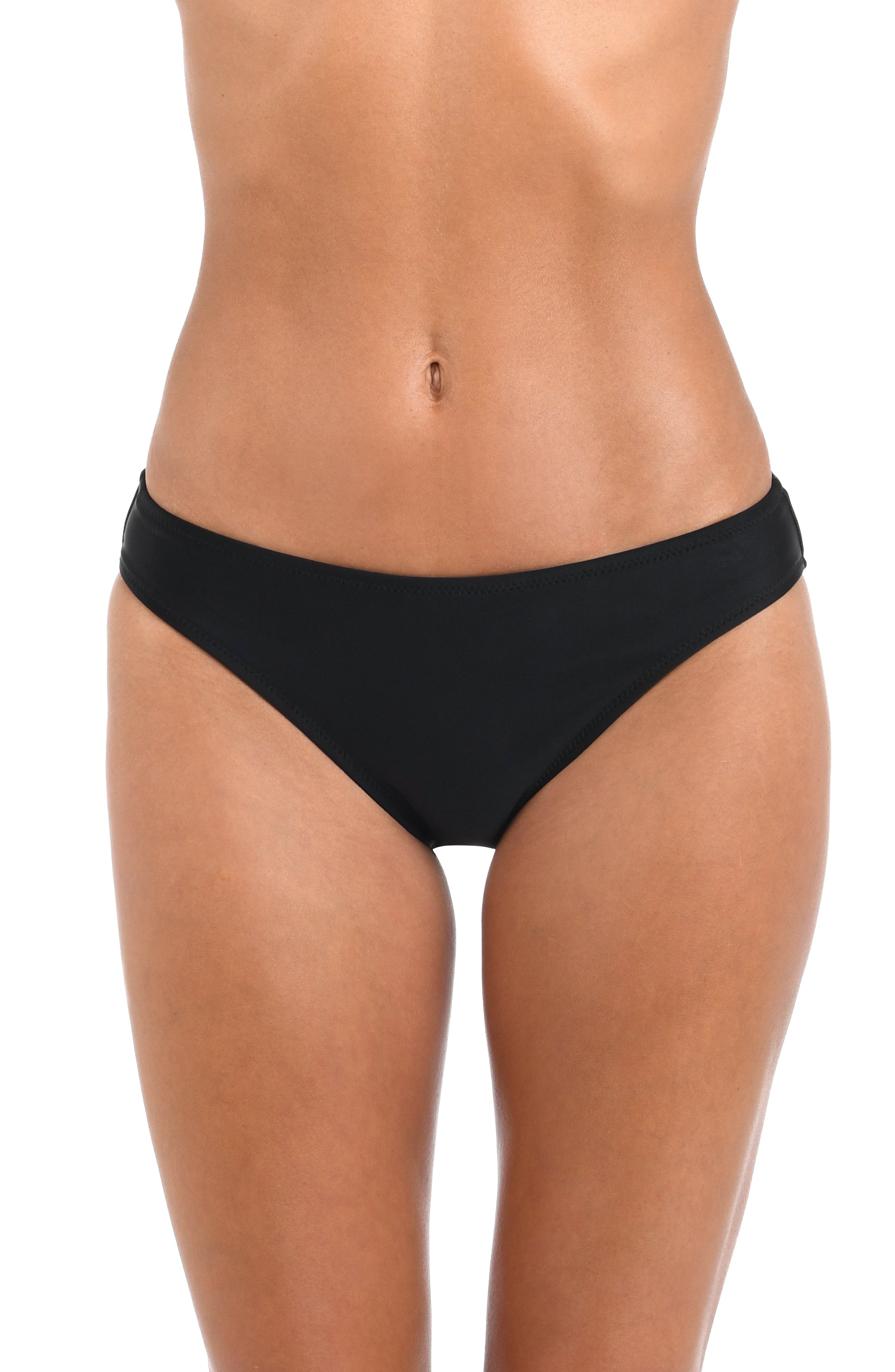 A close-up of a model's lower torso and thighs wearing black bikini bottoms against a plain white background.