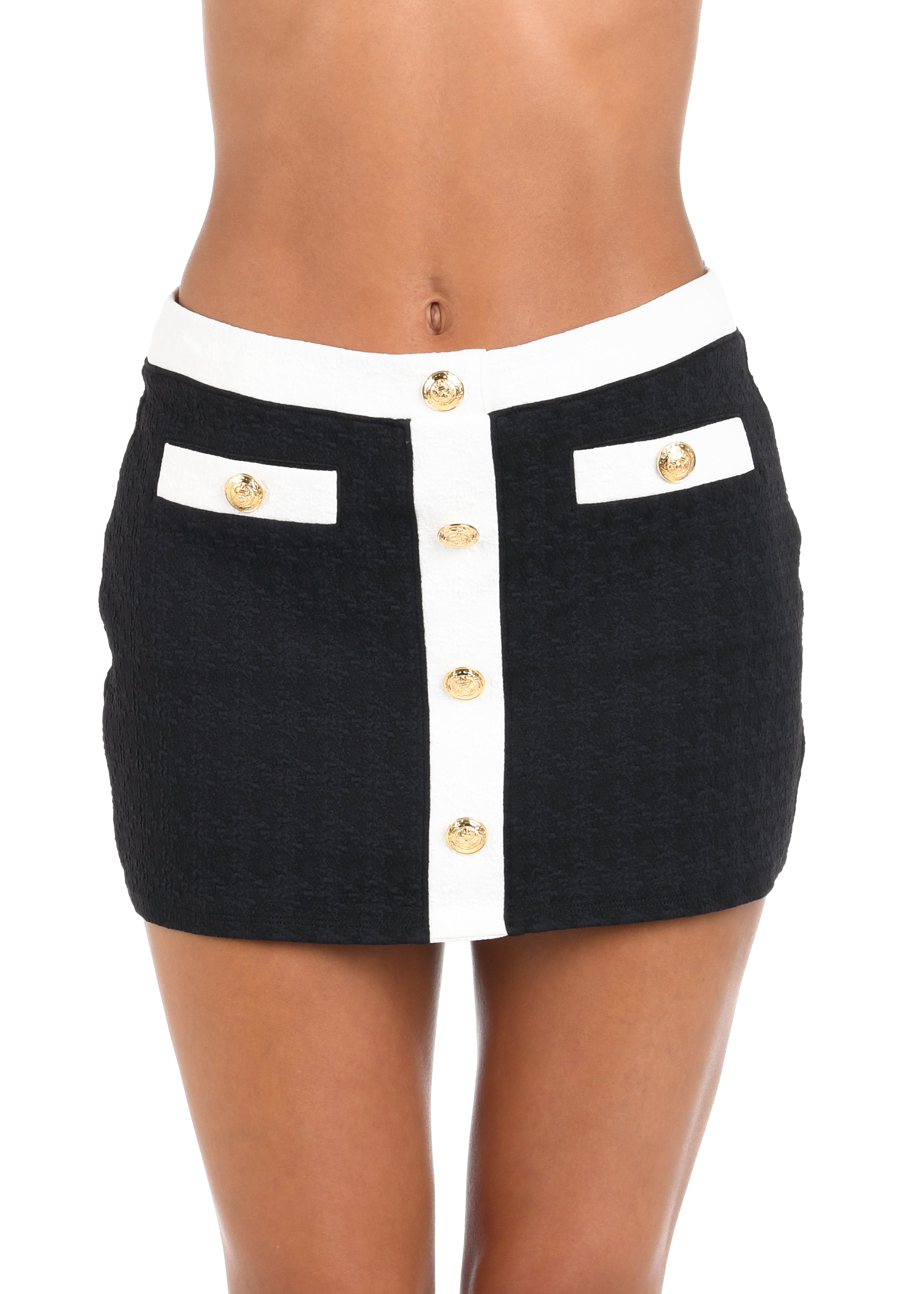 Black and white skirt with gold buttons on a white background