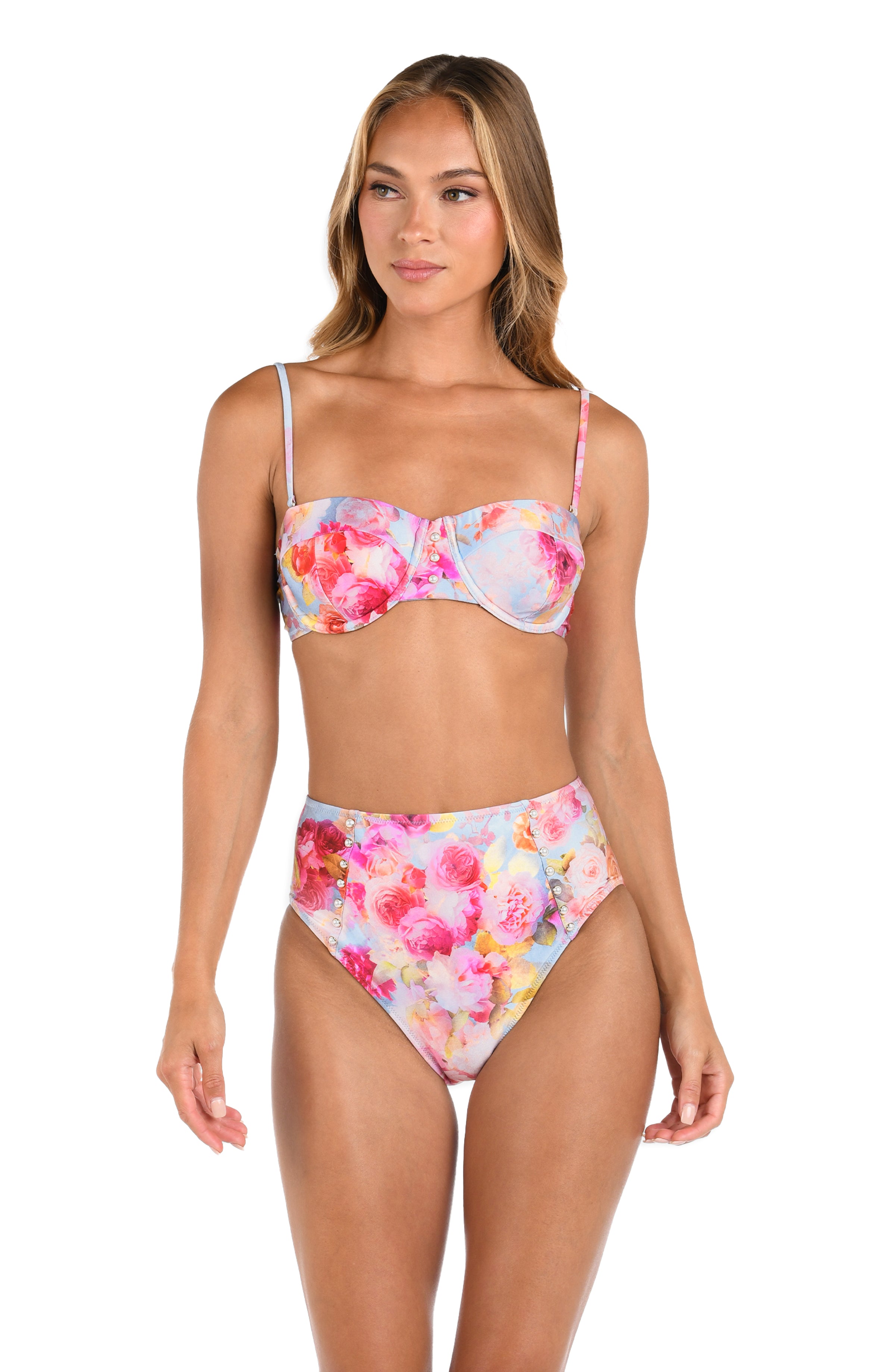 Woman wearing a multicolored floral bikini top and matching bottom against a white background. 