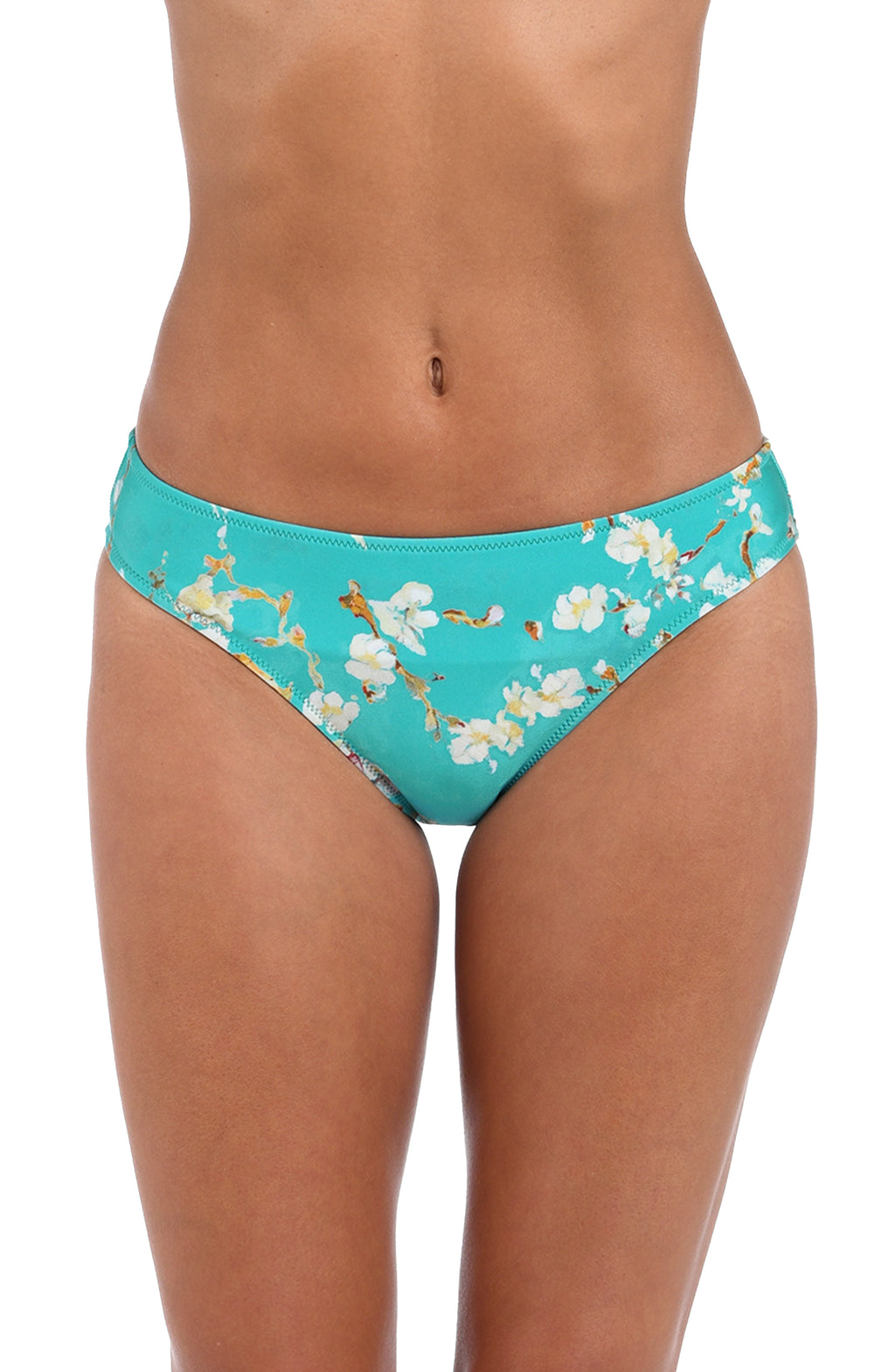 A model wearing a pair of bikini bottoms with a turquoise blue background and a white floral print with gold accents, shown against a plain white background.