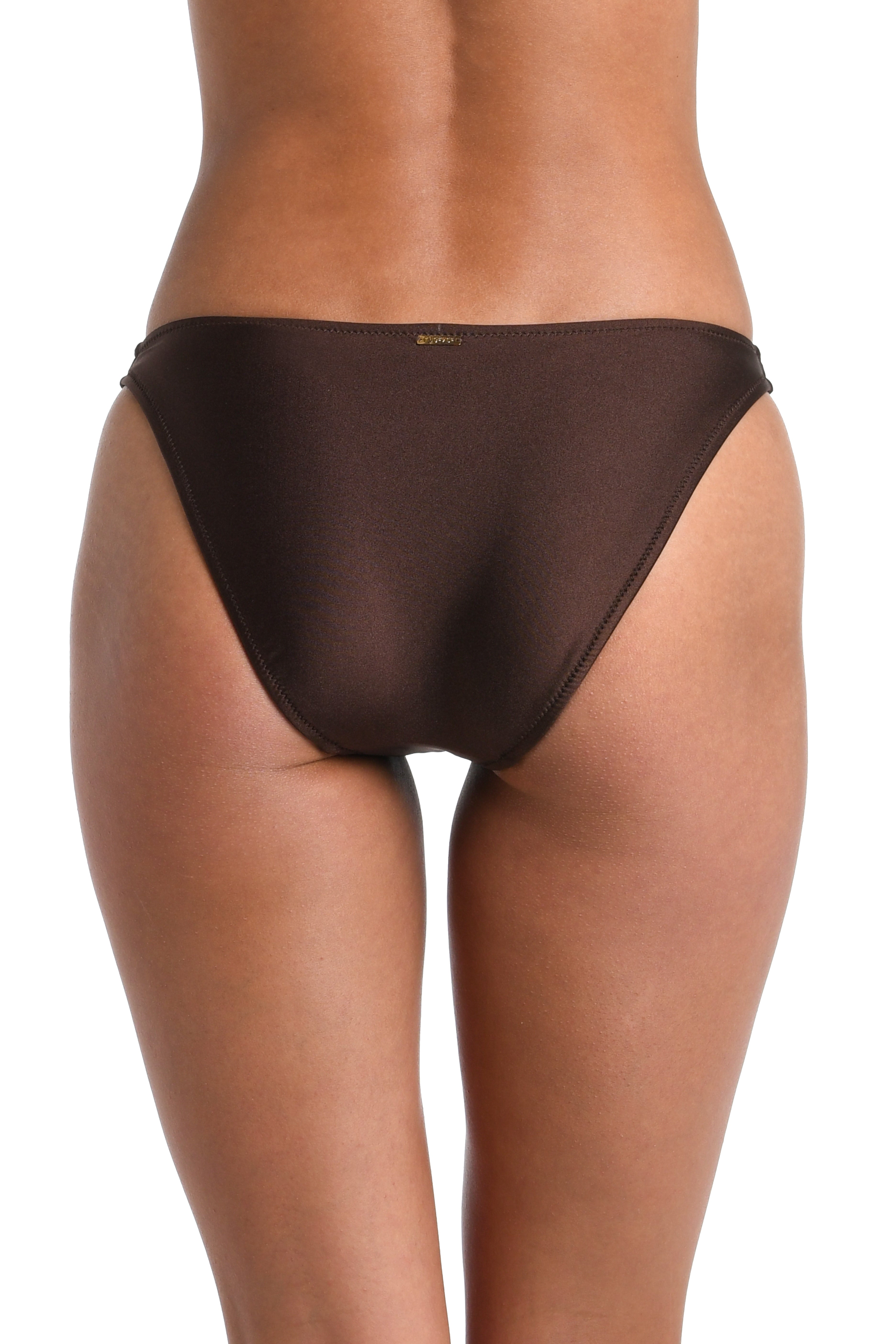 Rear view of a model wearing a sheer, dark brown mesh bikini bottom against a plain white background.