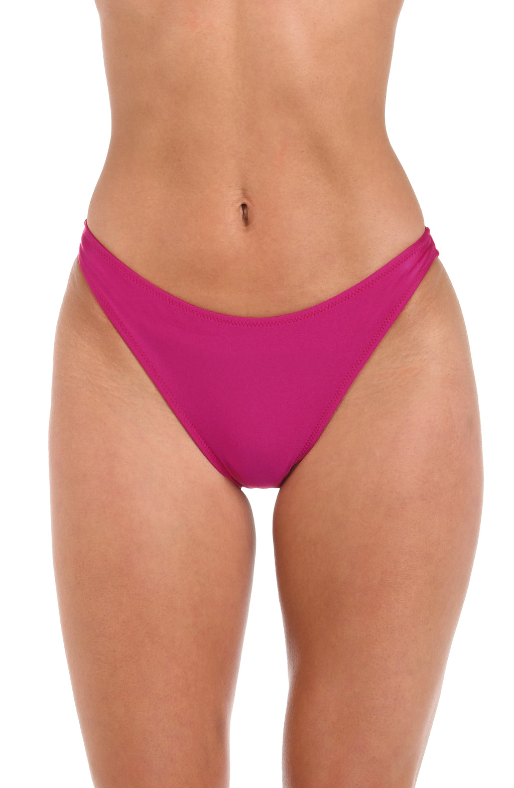 Woman wearing a solid fuchsia high leg bikini bottom against a white background.
