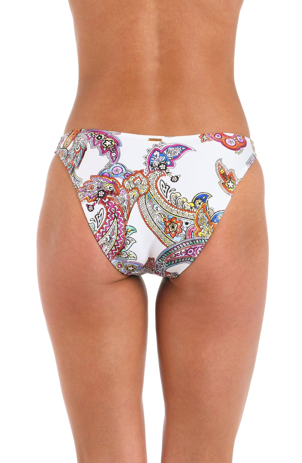 A woman wearing white bikini bottoms with a colorful paisley print, shown against a plain white background.