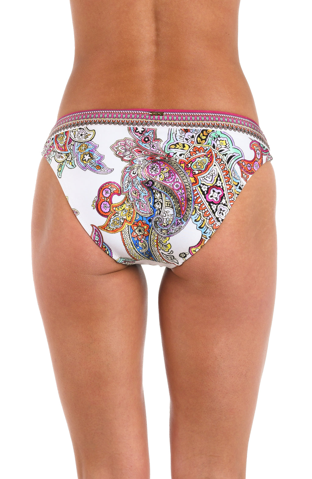 A woman wearing bikini bottoms with a white base, colorful paisley print, and a pink and multicolor patterned waistband.